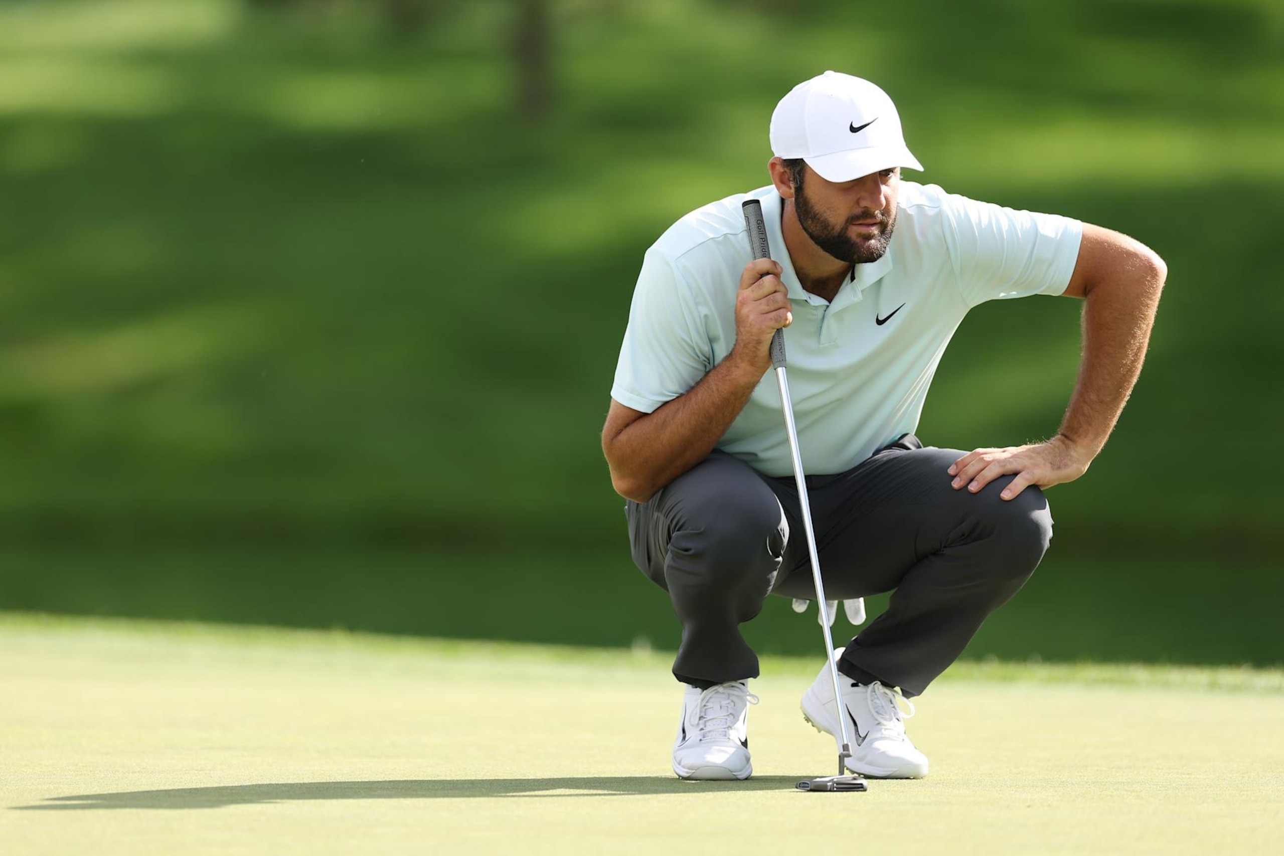 CASTLE ROCK, COLORADO - AUGUST 24: Scottie Scheffler of the United States lines up a putt on the third green during the third round of the BMW Championship at Castle Pines Golf Club on August 24, 2024 in Castle Rock, Colorado. (Photo by Christian Petersen/Getty Images)