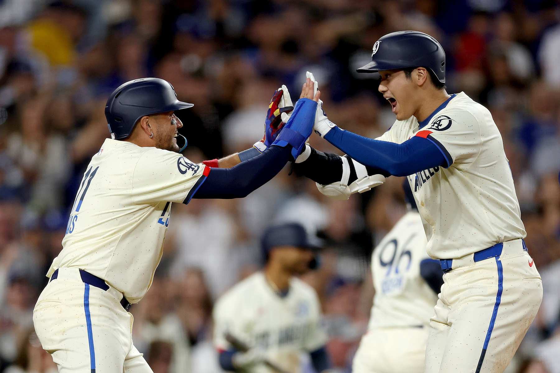 LOS ANGELES, CALIFORNIA - AUGUST 24: Shohei Ohtani #17 of the Los Angeles Dodgers celebrates his two run home run with teammate Miguel Rojas #11 during the fifth inning against the Tampa Bay Rays at Dodger Stadium on August 24, 2024 in Los Angeles, California. (Photo by Katelyn Mulcahy/Getty Images)