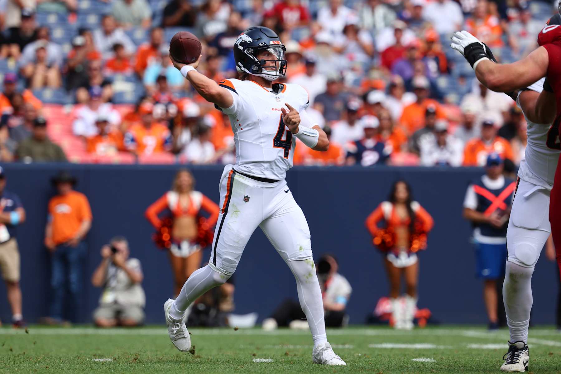 DENVER, COLORADO - AUGUST 25: Zach Wilson #4 of the Denver Broncos passes the ball against the Arizona Cardinals in the second quarter of a preseason game at Empower Field At Mile High on August 25, 2024 in Denver, Colorado. (Photo by Justin Tafoya/Getty Images)