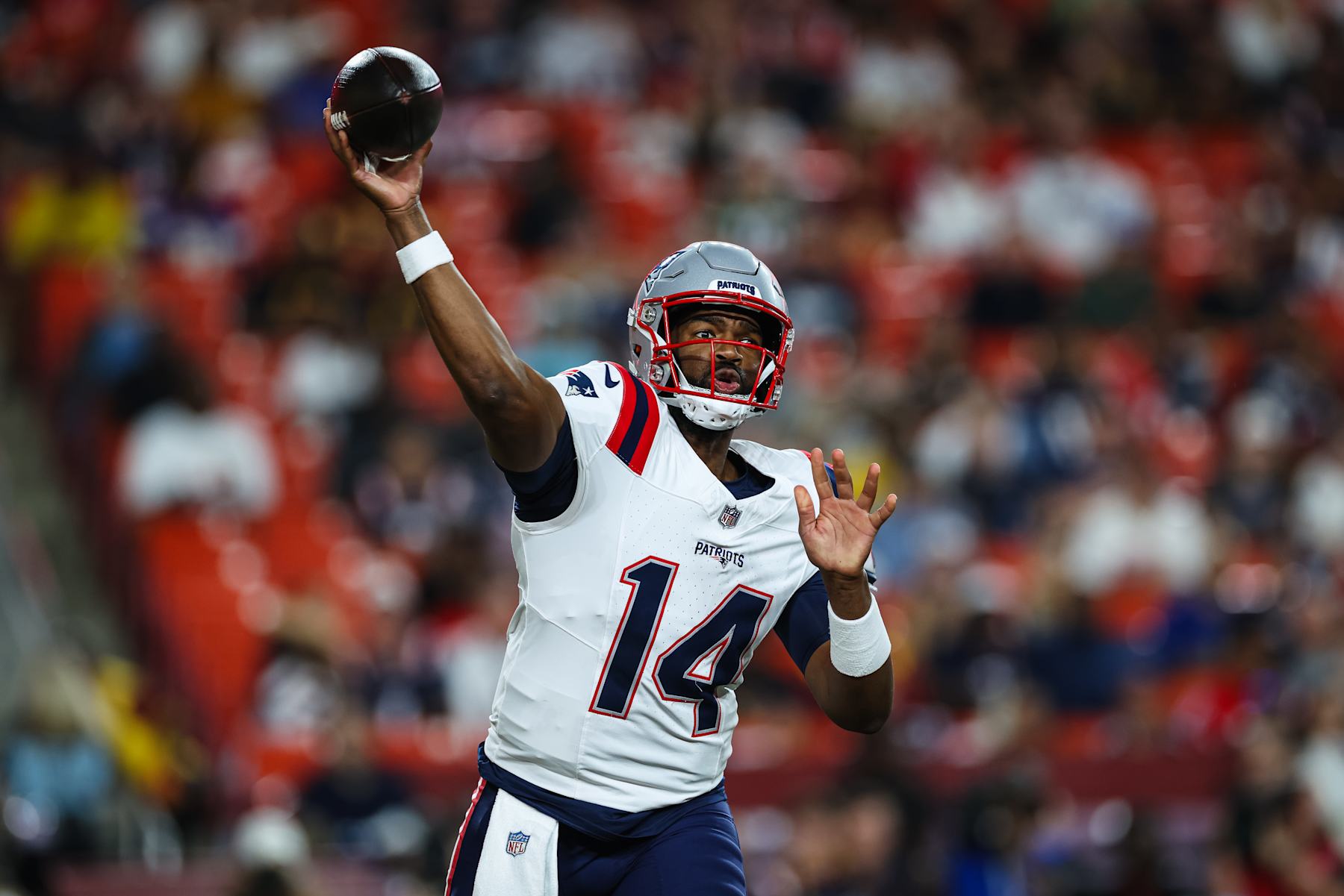 LANDOVER, MD - AUGUST 25: Jacoby Brissett #14 of the New England Patriots passes against the Washington Commanders in the first quarter of a preseason game at Commanders Field on August 25, 2024 in Landover, Maryland. (Photo by Scott Taetsch/Getty Images)