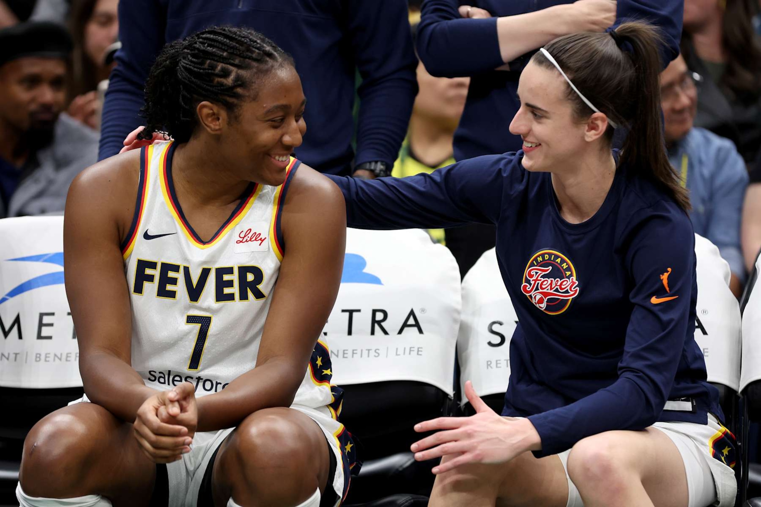 SEATTLE, WASHINGTON - JUNE 27: Aliyah Boston #7 and Caitlin Clark #22 of the Indiana Fever sit on the bench before the game against the Seattle Storm at Climate Pledge Arena on June 27, 2024 in Seattle, Washington. NOTE TO USER: User expressly acknowledges and agrees that, by downloading and or using this photograph, User is consenting to the terms and conditions of the Getty Images License Agreement. (Photo by Steph Chambers/Getty Images)