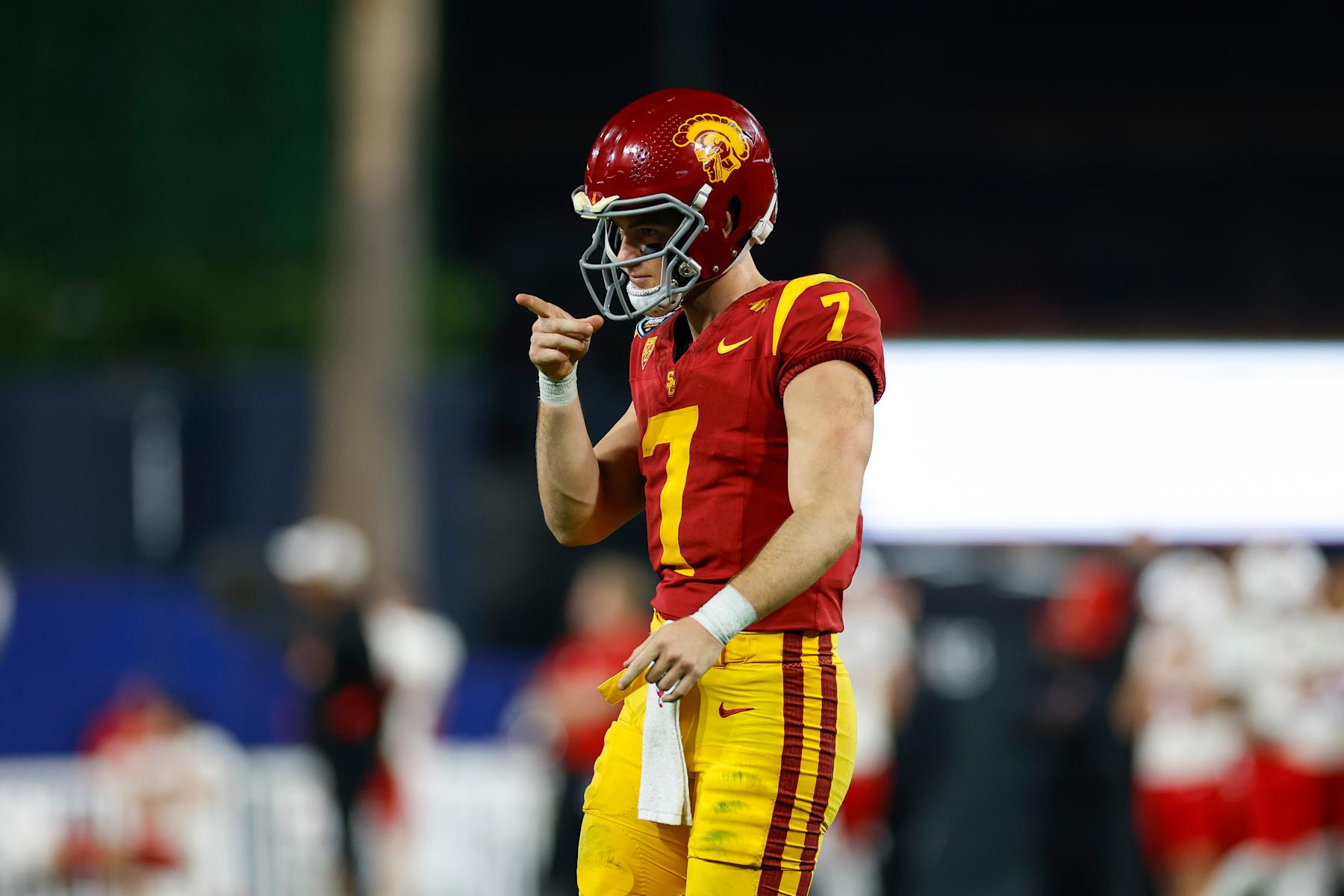SAN DIEGO, CALIFORNIA - DECEMBER 27: Miller Moss #7 of the USC Trojans celebrates in the second half during the DIRECTV Holiday Bowl game against the Louisville Cardinals at Petco Park on December 27, 2023 in San Diego, California. (Photo by Brandon Sloter/Getty Images)