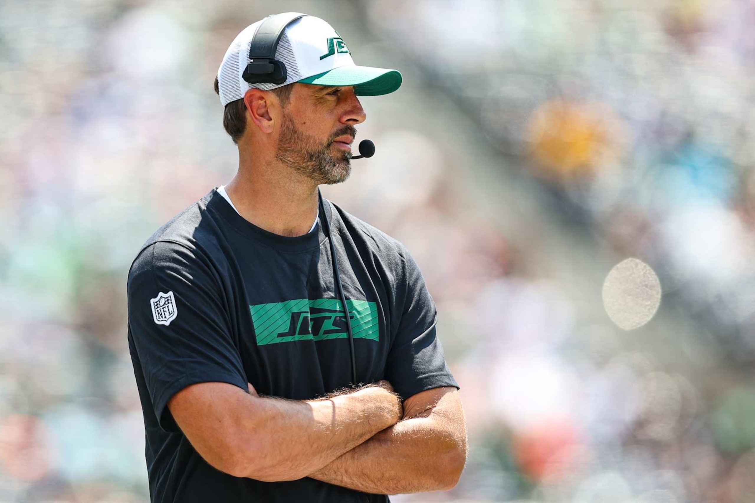 EAST RUTHERFORD, NJ - AUGUST 10: Aaron Rodgers #8 of the New York Jets looks on during an NFL football game against the Washington Commanders at MetLife Stadium on August 10, 2024 in East Rutherford, NJ. (Photo by Perry Knotts/Getty Images)