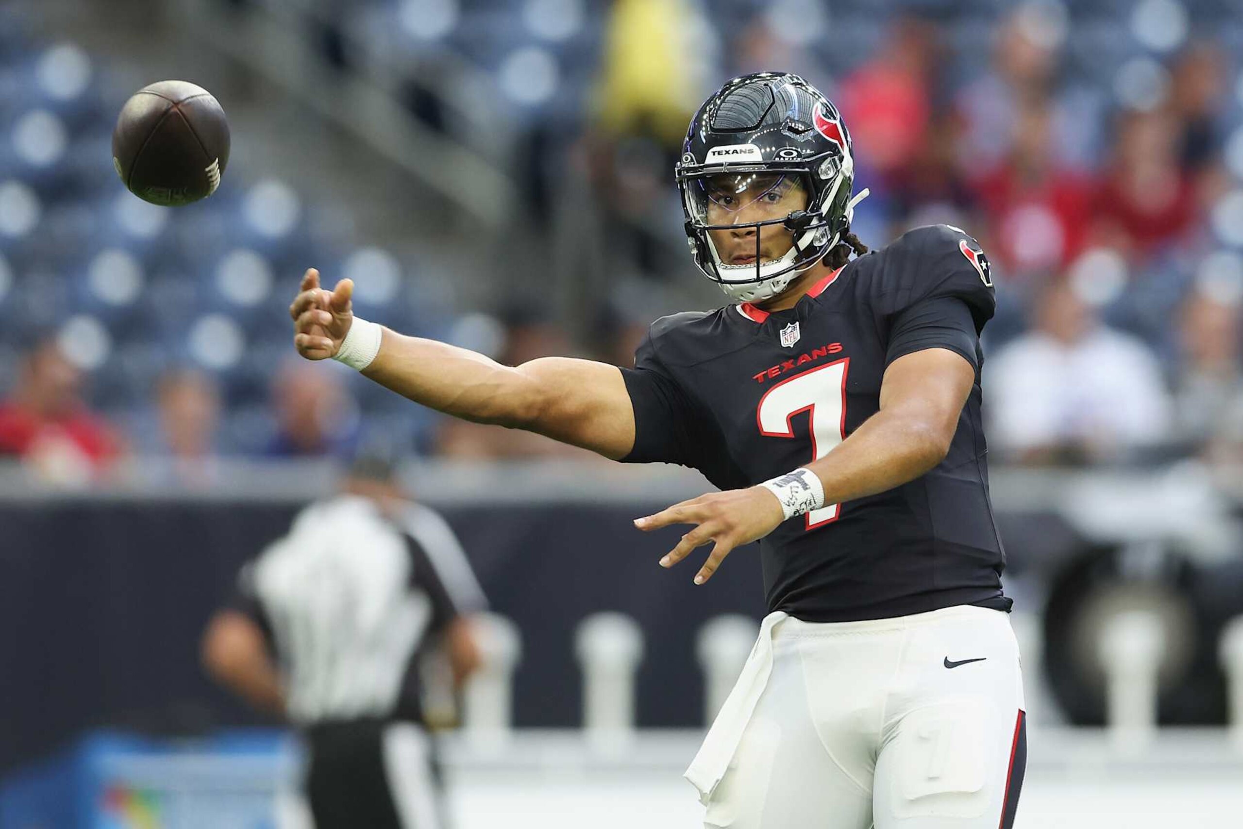 HOUSTON, TEXAS - AUGUST 17: C.J. Stroud #7 of the Houston Texans throws a pass before the preseason game against the New York Giants at NRG Stadium on August 17, 2024 in Houston, Texas. (Photo by Tim Warner/Getty Images)