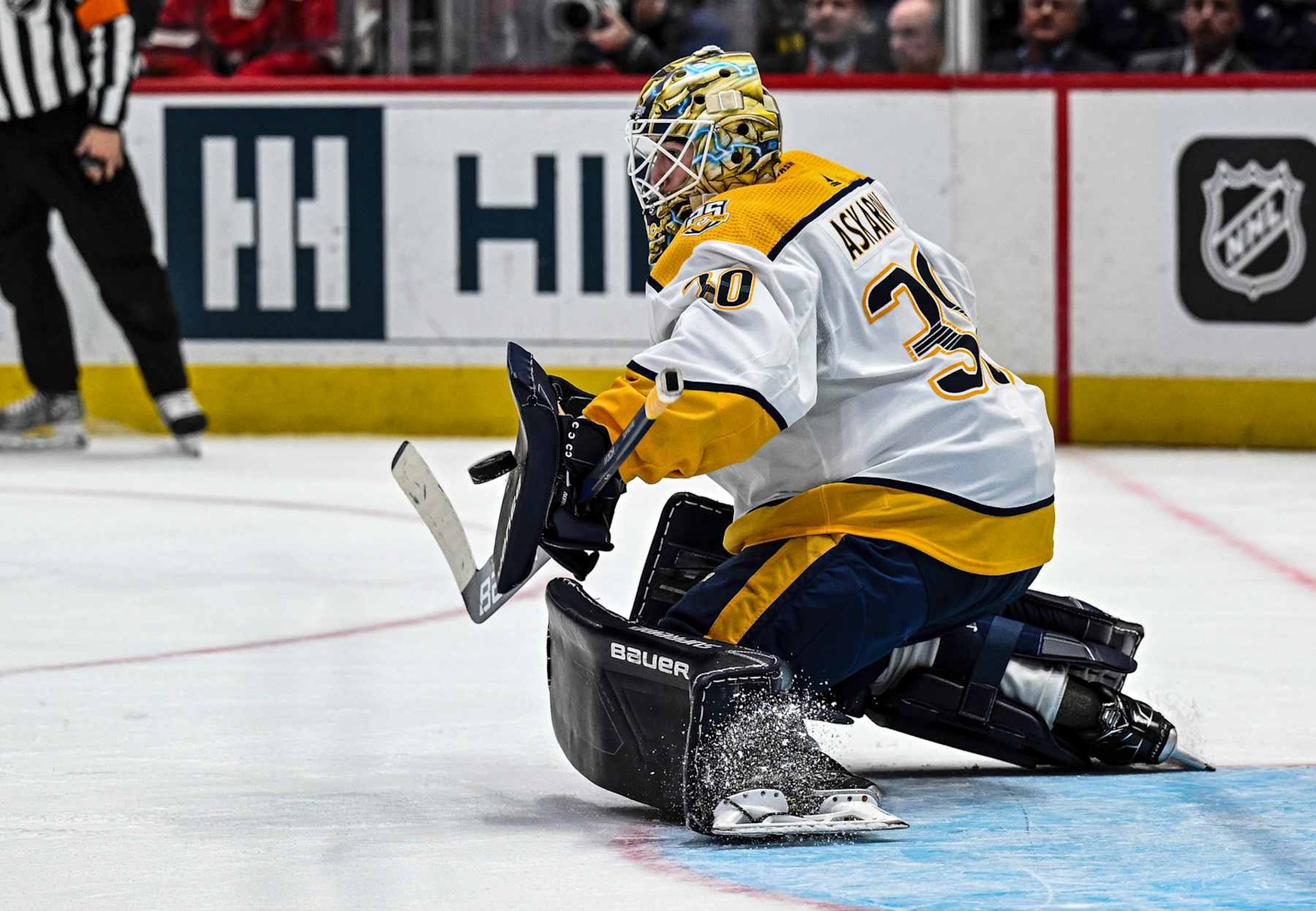 WASHINGTON, DC - DECEMBER 30: Nashville Predators goaltender Yaroslav Askarov (30) makes a save during the Nashville Predators game versus the Washington Capitals on December 30, 2023 at the Capital One Arena in Washington, D.C.  (Photo by Mark Goldman/Icon Sportswire via Getty Images)