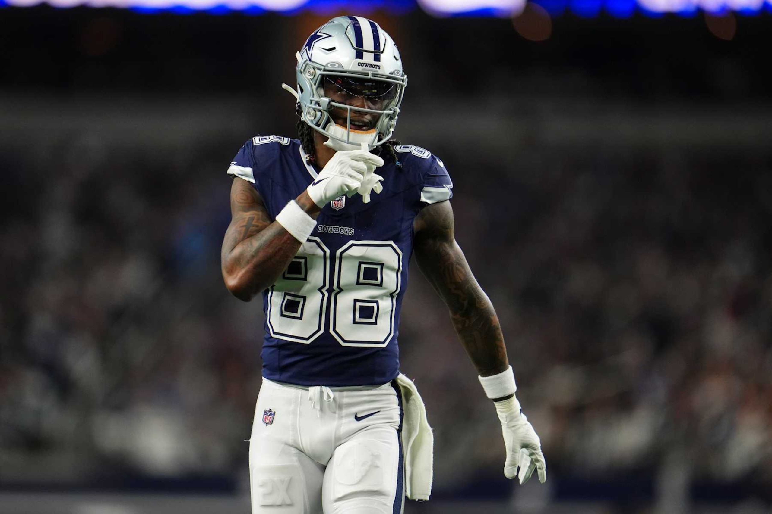 ARLINGTON, TX - DECEMBER 30: CeeDee Lamb #88 of the Dallas Cowboys looks on from the field during an NFL football game against the Detroit Lions at AT&T Stadium on December 30, 2023 in Arlington, Texas. (Photo by Cooper Neill/Getty Images)