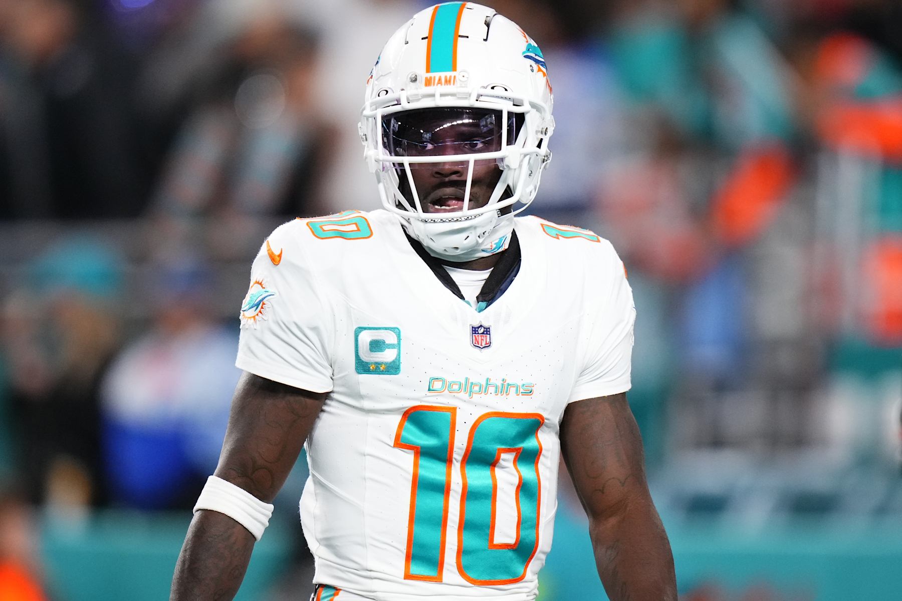 MIAMI GARDENS, FLORIDA - JANUARY 07: Tyreek Hill #10 of the Miami Dolphins warms up prior to a game against the Buffalo Bills at Hard Rock Stadium on January 07, 2024 in Miami Gardens, Florida. (Photo by Rich Storry/Getty Images)