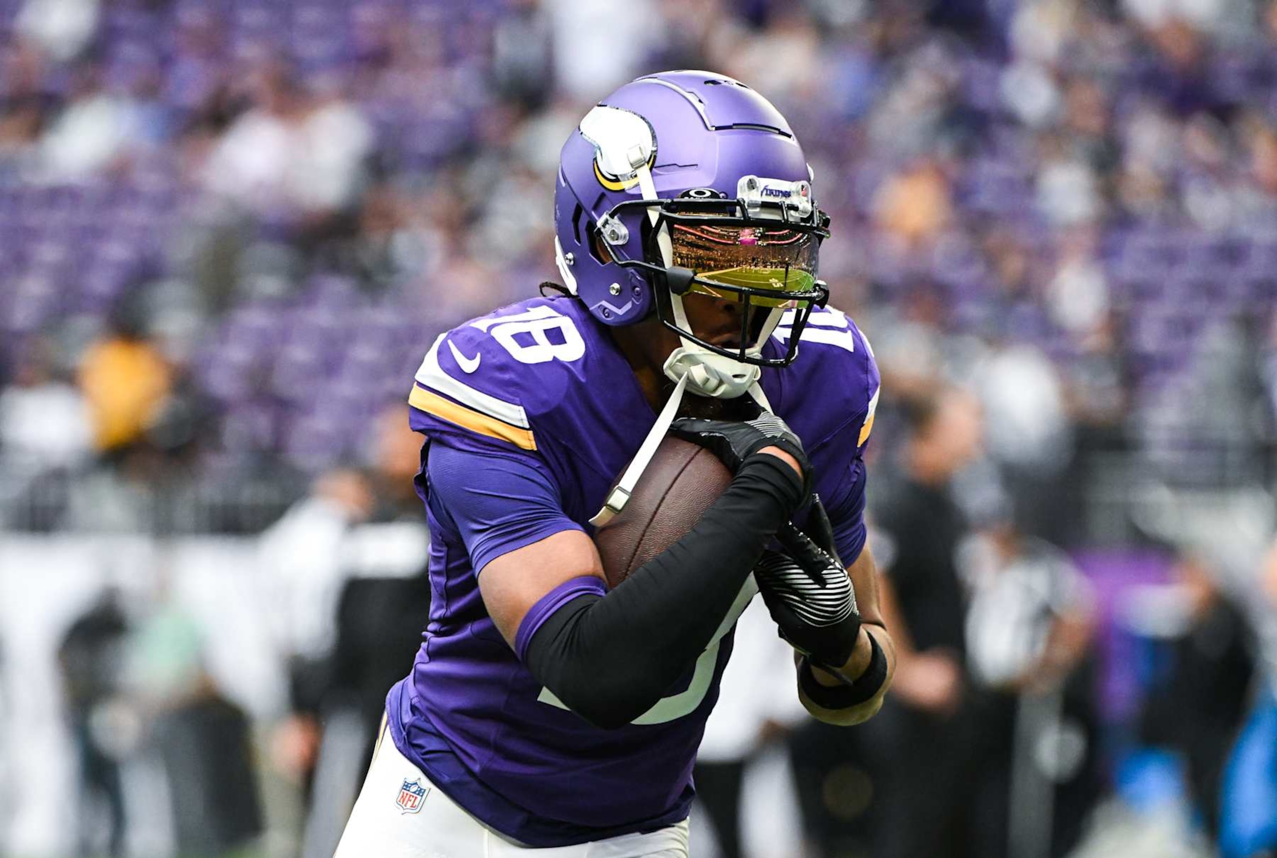 MINNEAPOLIS, MINNESOTA - AUGUST 10: Justin Jefferson #18 of the Minnesota Vikings warms up before the preseason game against the Las Vegas Raiders at U.S. Bank Stadium on August 10, 2024 in Minneapolis, Minnesota. (Photo by Stephen Maturen/Getty Images)