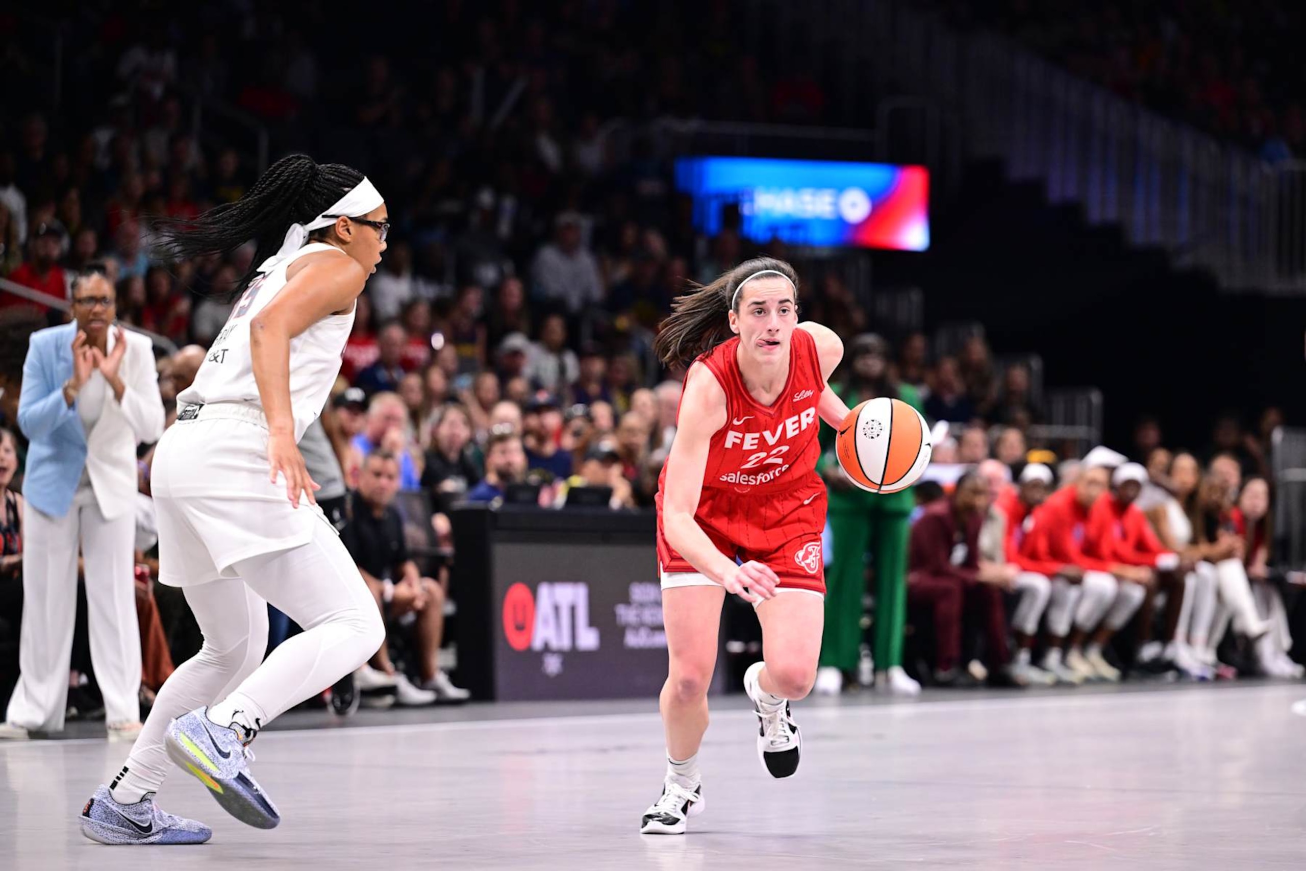 ATLANTA, GA - AUGUST 26: Caitlin Clark #22 of the Indiana Fever handles the ball during the game against the Atlanta Dream on August 26, 2024 at State Farm Arena in Atlanta, Georgia.  NOTE TO USER: User expressly acknowledges and agrees that, by downloading and/or using this Photograph, user is consenting to the terms and conditions of the Getty Images License Agreement. Mandatory Copyright Notice: Copyright 2024 NBAE (Photo by Adam Hagy/NBAE via Getty Images)