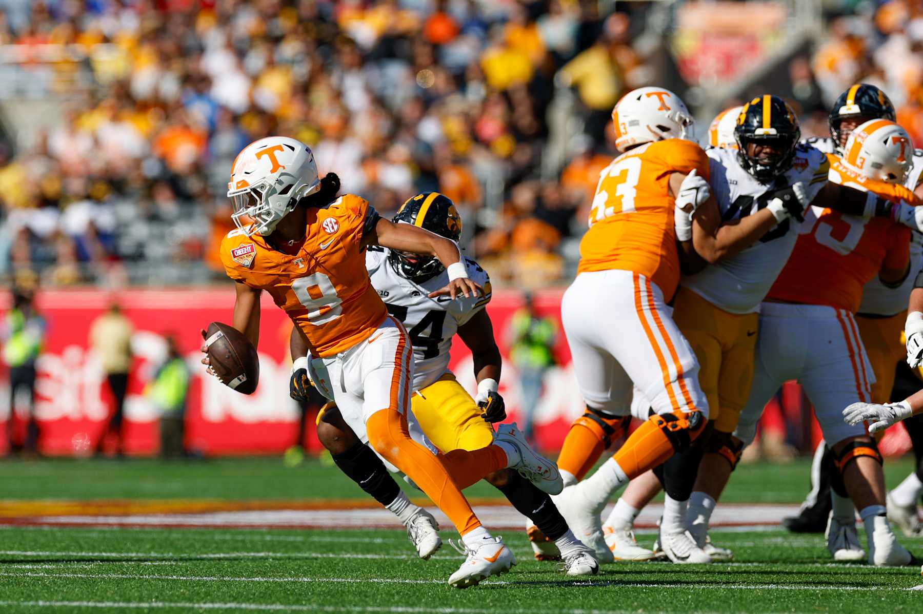 ORLANDO, FL - JANUARY 01: Tennessee Volunteers quarterback Nico Iamaleava (8) runs with the ball during the game between the Tennessee Volunteers and the Iowa Hawkeyes on January 1, 2024 at Camping World Stadium in Orlando, Fl. (Photo by David Rosenblum/Icon Sportswire via Getty Images)