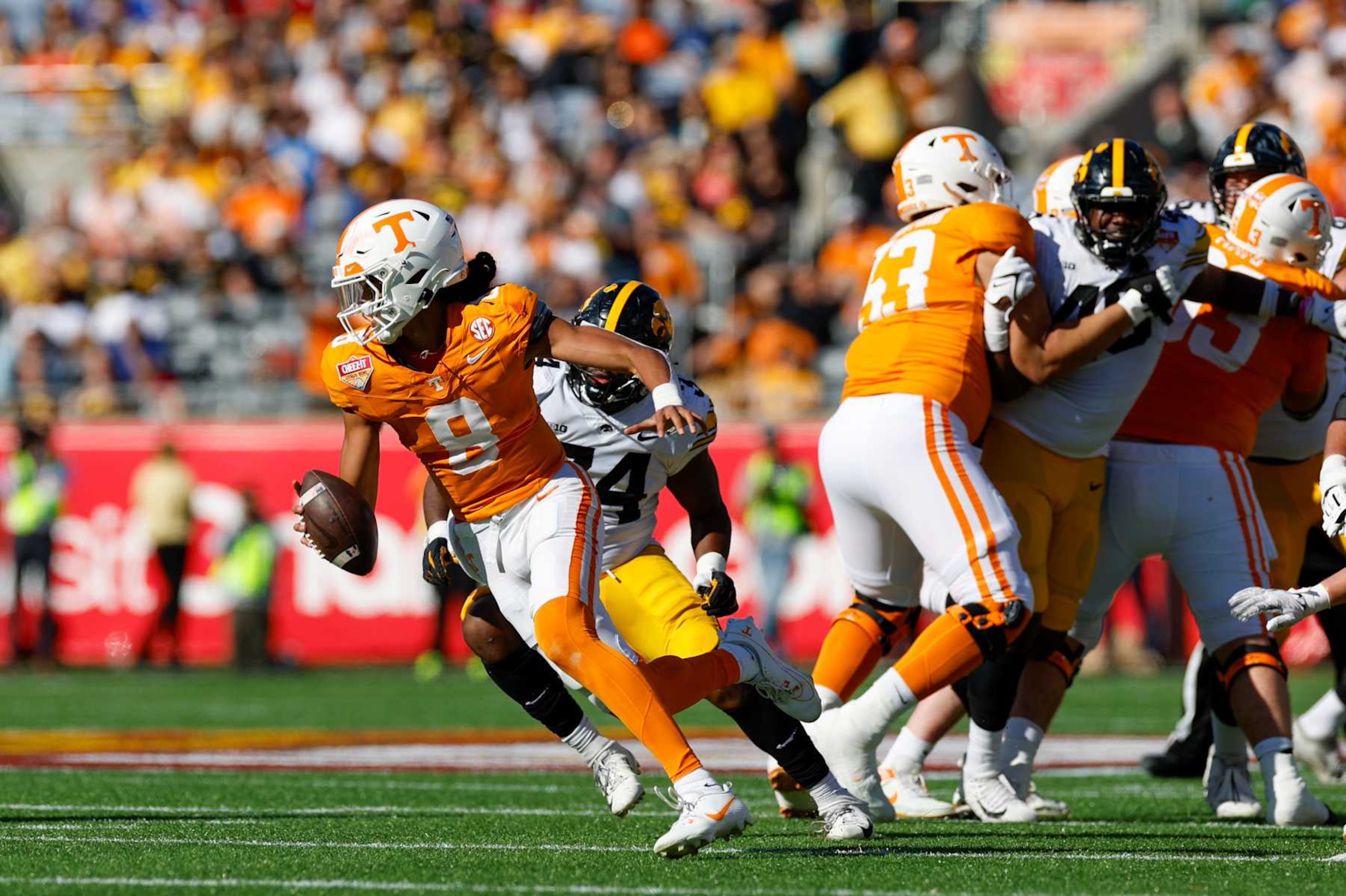 ORLANDO, FL - JANUARY 01: Tennessee Volunteers quarterback Nico Iamaleava (8) runs with the ball during the game between the Tennessee Volunteers and the Iowa Hawkeyes on January 1, 2024 at Camping World Stadium in Orlando, Fl. (Photo by David Rosenblum/Icon Sportswire via Getty Images)