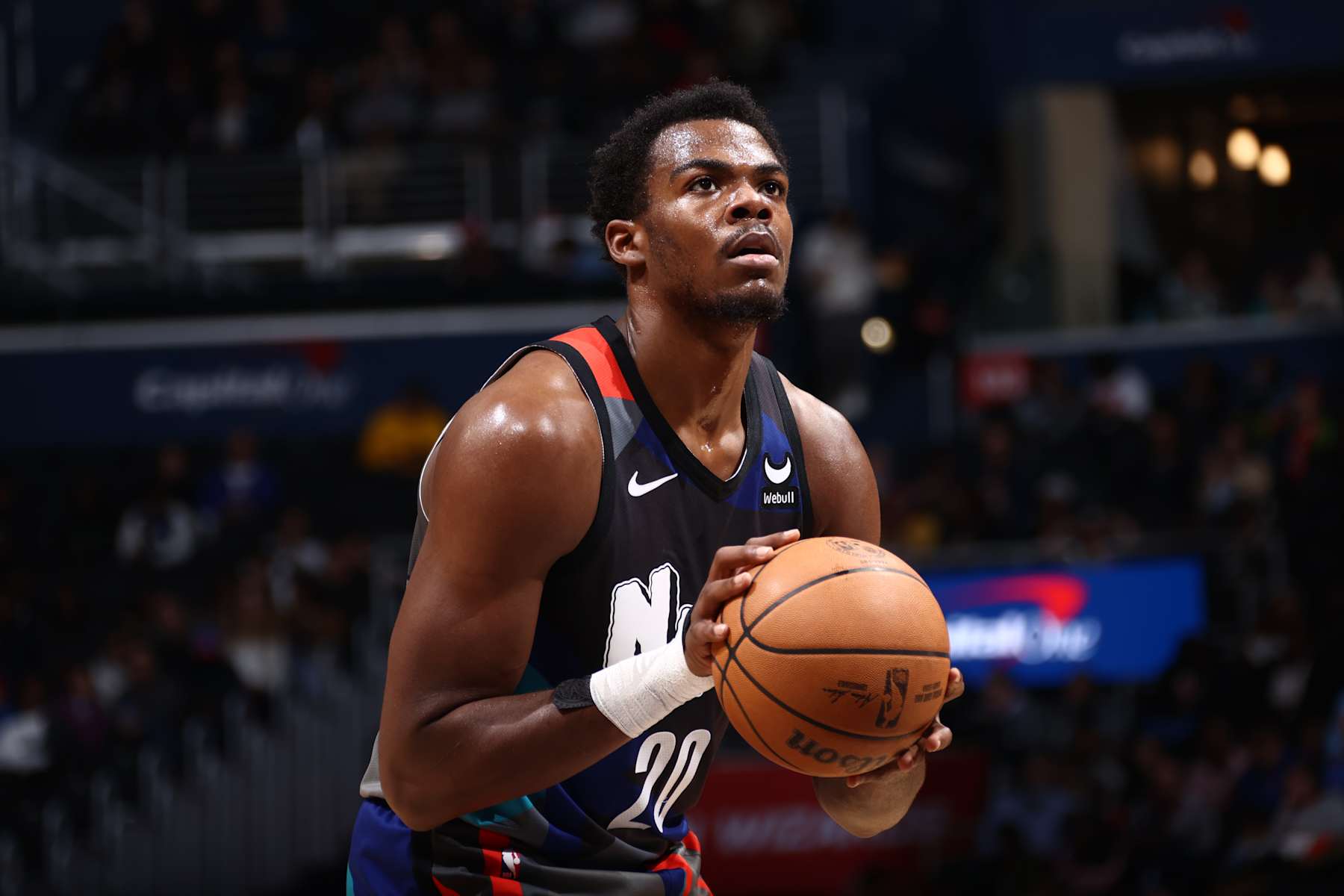 WASHINGTON, DC -  MARCH 27: Day'Ron Sharpe #20 of the Brooklyn Nets shoots a free throw during the game against the Washington Wizards on March 27, 2024 NBAE at Capital One Arena in Washington, DC. NOTE TO USER: User expressly acknowledges and agrees that, by downloading and or using this Photograph, user is consenting to the terms and conditions of the Getty Images License Agreement. Mandatory Copyright Notice: Copyright 2024 NBAE (Photo by Kenny Giarla/NBAE via Getty Images)