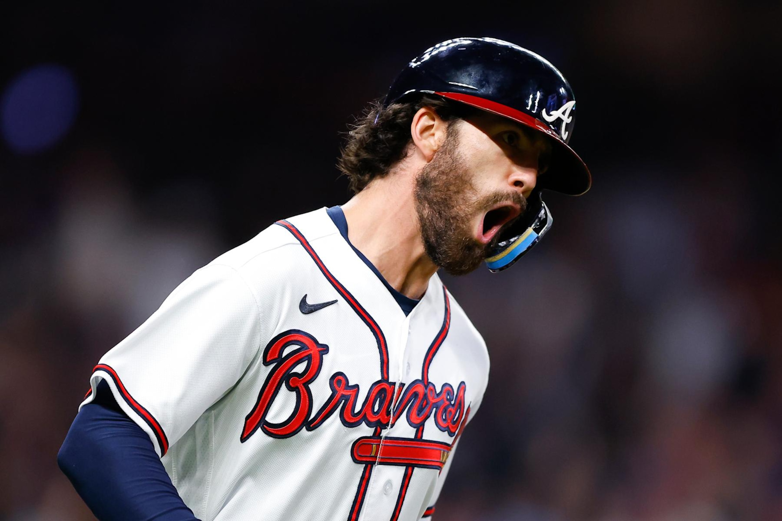 ATLANTA, GA - OCTOBER 01: Dansby Swanson #7 of the Atlanta Braves reacts after hitting a two run home run during the fifth inning against the New York Mets at Truist Park on October 1, 2022 in Atlanta, Georgia. (Photo by Todd Kirkland/Getty Images)