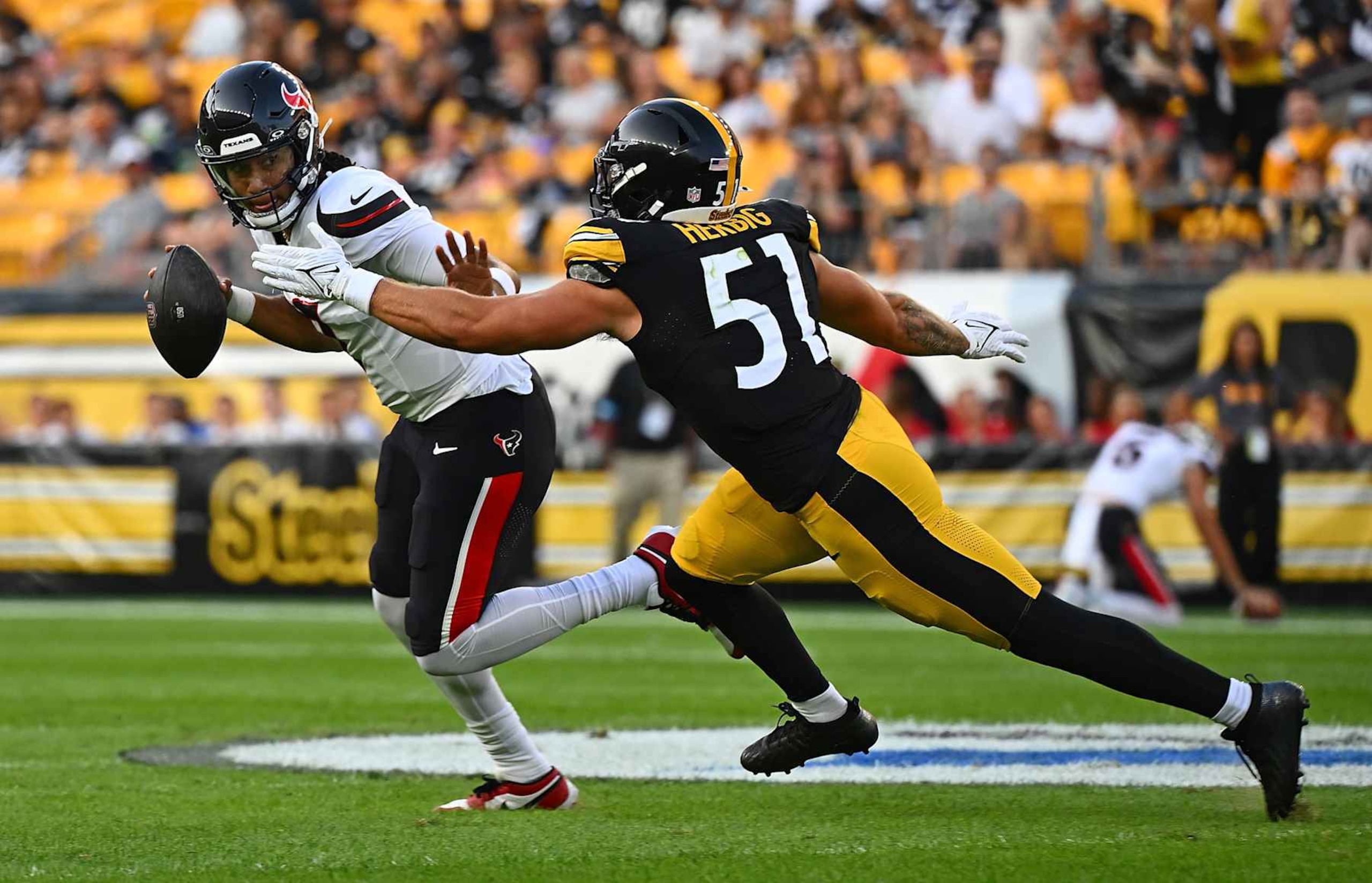 PITTSBURGH, PENNSYLVANIA - AUGUST 09: C.J. Stroud #7 of the Houston Texans scrambles under pressure from Nick Herbig #51 of the Pittsburgh Steelers in the first quarter during the preseason game at Acrisure Stadium on August 9, 2024 in Pittsburgh, Pennsylvania. (Photo by Justin Berl/Getty Images)