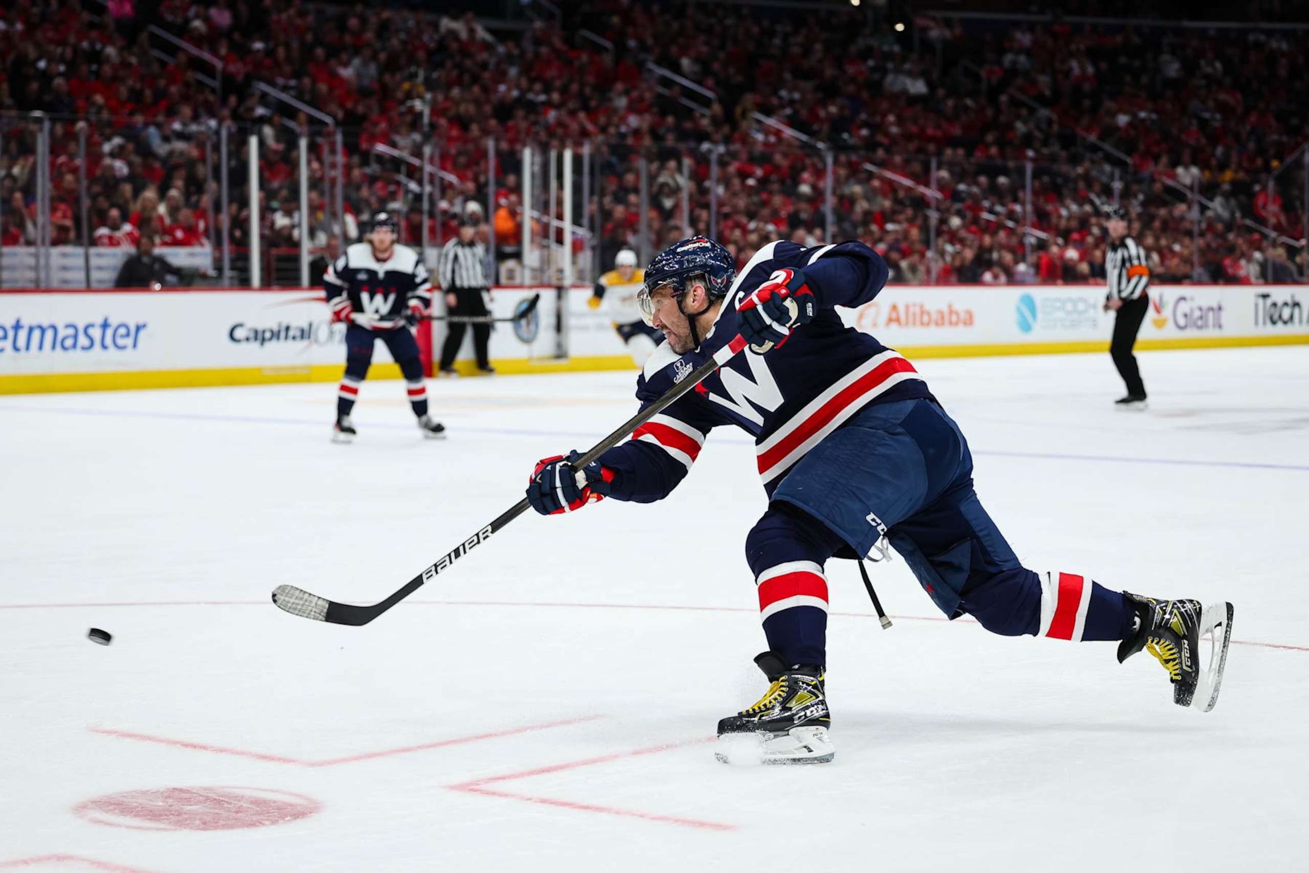 WASHINGTON, DC - DECEMBER 30: Alex Ovechkin #8 of the Washington Capitals scores a goal against the Nashville Predators during the second period of the game at Capital One Arena on December 30, 2023 in Washington, DC. (Photo by Scott Taetsch/Getty Images) WASHINGTON, DC - DECEMBER 30: Alex Ovechkin #8 of the Washington Capitals scores a goal against the Nashville Predators during the second period of the game at Capital One Arena on December 30, 2023 in Washington, DC. (Photo by Scott Taetsch/Getty Images)