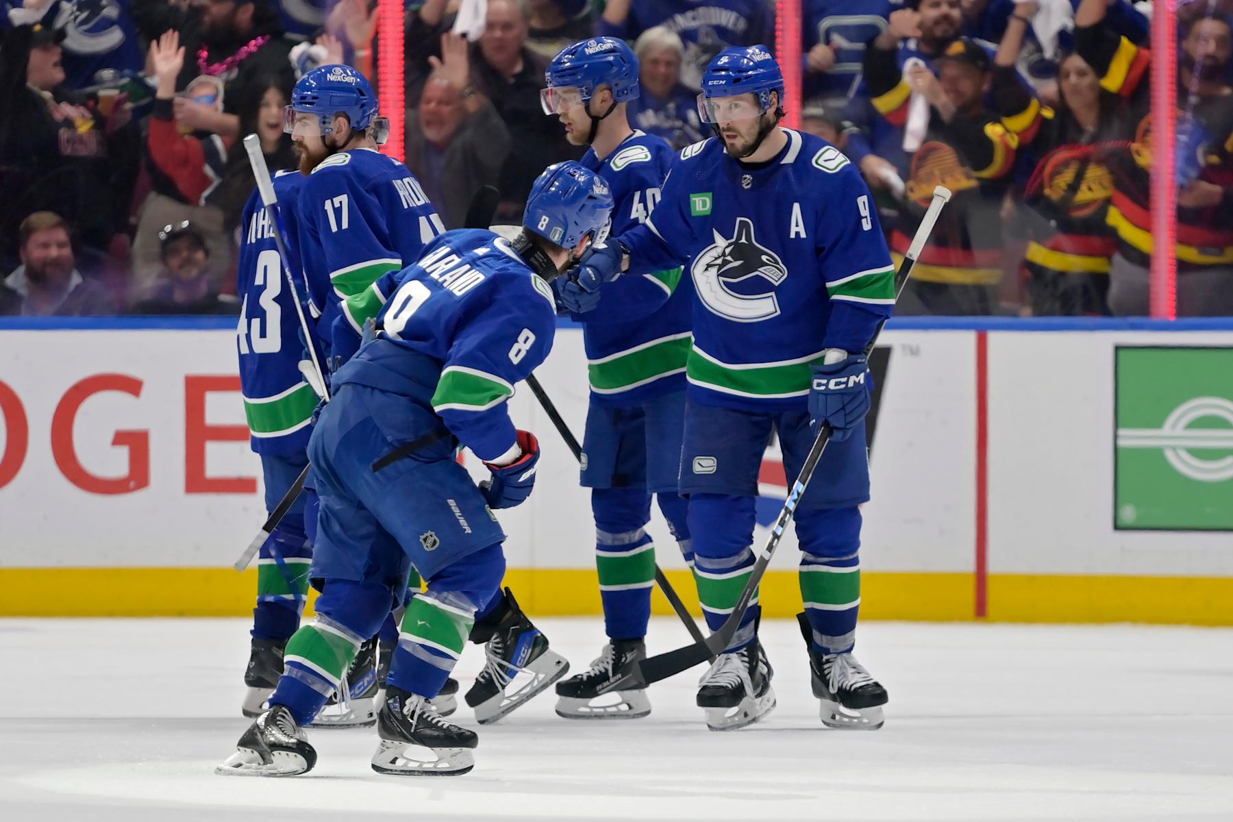 VANCOUVER, BRITISH COLUMBIA - MAY 20: Conor Garland #8 of the Vancouver Canucks celebrates with teammates after his goal during the third period in Game Seven of the Second Round of the 2024 Stanley Cup Playoffs at Rogers Arena on May 20, 2024 in Vancouver, British Columbia. (Photo by Derek Cain/Getty Images)
