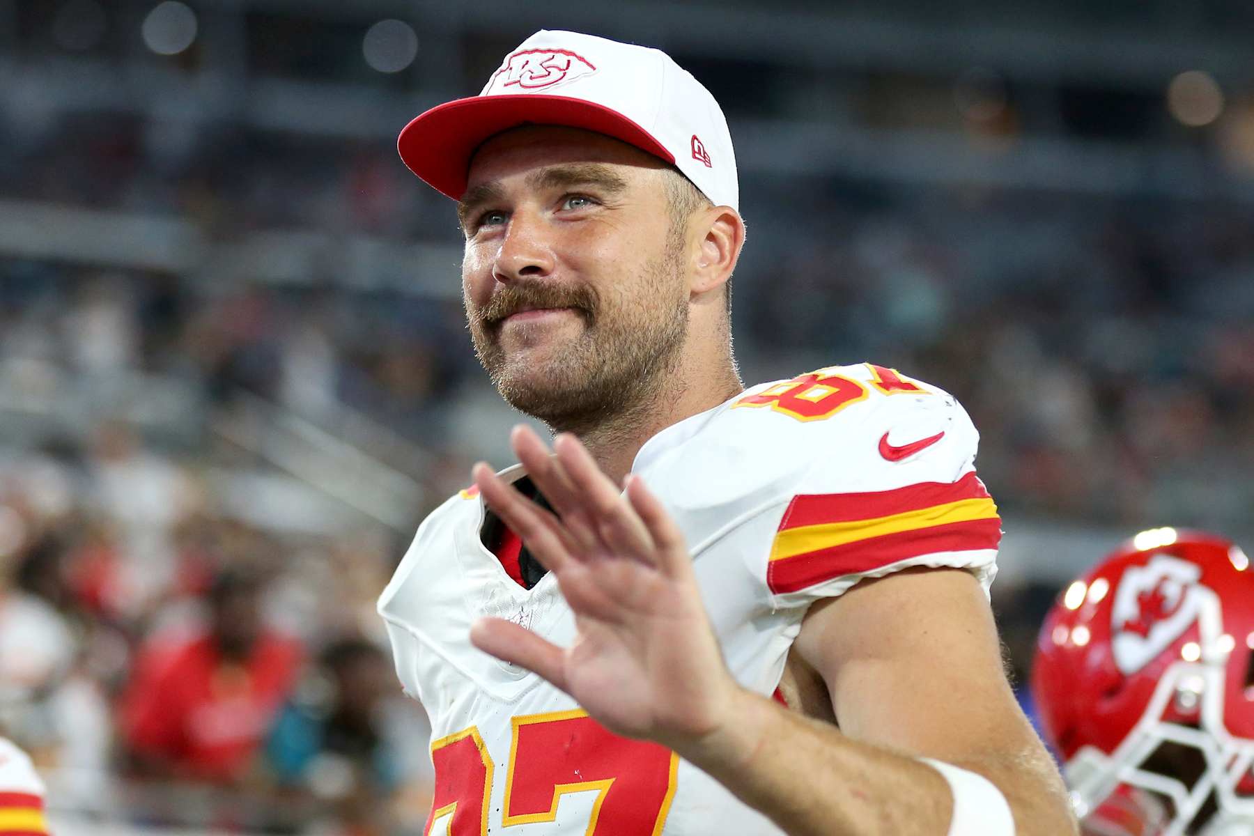 JACKSONVILLE, FLORIDA - AUGUST 10: Travis Kelce #87 of the Kansas City Chiefs waves at fans as he leaves the field at halftime during a preseason game against the Jacksonville Jaguars at EverBank Stadium on August 10, 2024 in Jacksonville, Florida. (Photo by Courtney Culbreath/Getty Images)