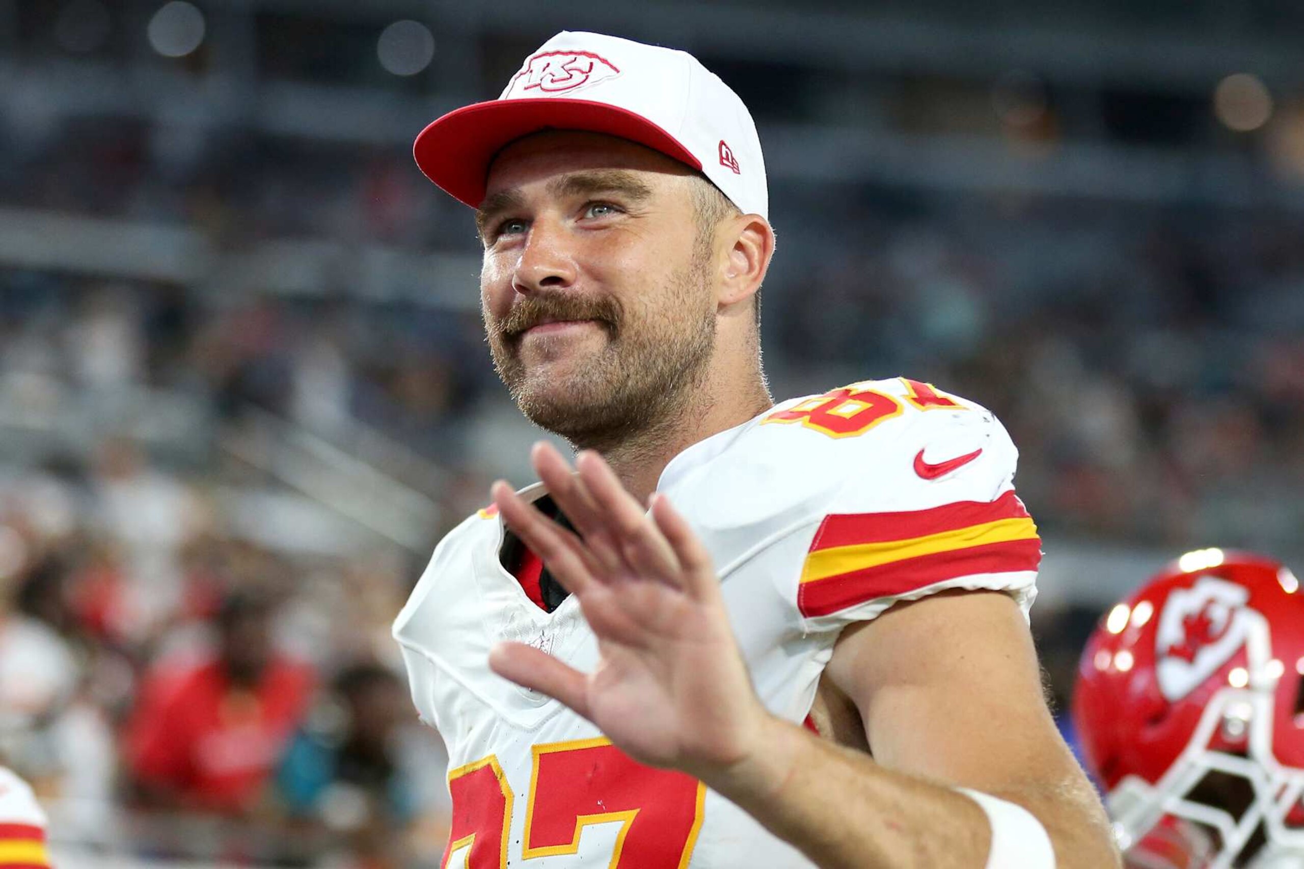JACKSONVILLE, FLORIDA - AUGUST 10: Travis Kelce #87 of the Kansas City Chiefs waves at fans as he leaves the field at halftime during a preseason game against the Jacksonville Jaguars at EverBank Stadium on August 10, 2024 in Jacksonville, Florida. (Photo by Courtney Culbreath/Getty Images)