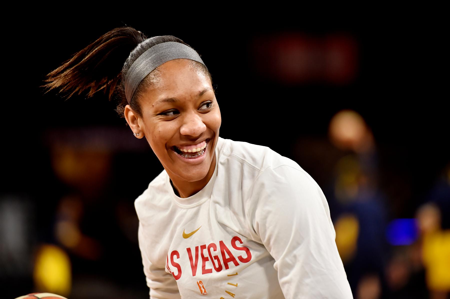 LAS VEGAS, NV - JULY 22:   A'ja Wilson #22 of the Las Vegas Aces looks on during warm ups prior to the game against the Indiana Fever on July 22, 2018 at the Mandalay Bay Events Center in Las Vegas, Nevada.  NOTE TO USER: User expressly acknowledges and agrees that, by downloading and or using this Photograph, user is consenting to the terms and conditions of the Getty Images License Agreement. Mandatory Copyright Notice: Copyright 2018 NBAE (Photo by David Becker/NBAE via Getty Images)