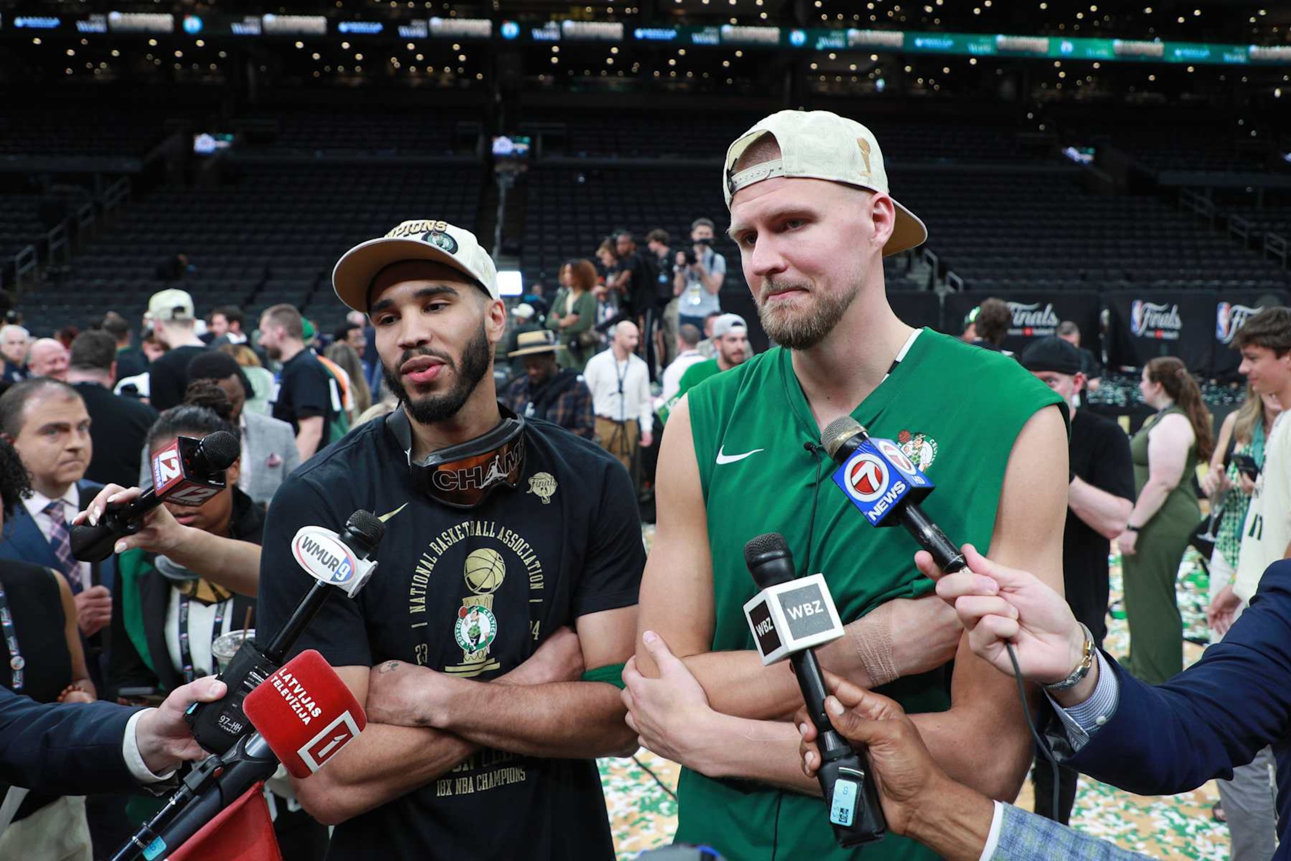 BOSTON, MA - JUNE 17: Jayson Tatum #0 and Kristaps Porzingis #8 of the Boston Celtics talks to the media after the game against the Dallas Mavericks during Game 5 of the 2024 NBA Finals on June 17, 2024 at the TD Garden in Boston, Massachusetts. NOTE TO USER: User expressly acknowledges and agrees that, by downloading and or using this photograph, User is consenting to the terms and conditions of the Getty Images License Agreement. Mandatory Copyright Notice: Copyright 2024 NBAE  (Photo by Chris Marion/NBAE via Getty Images)