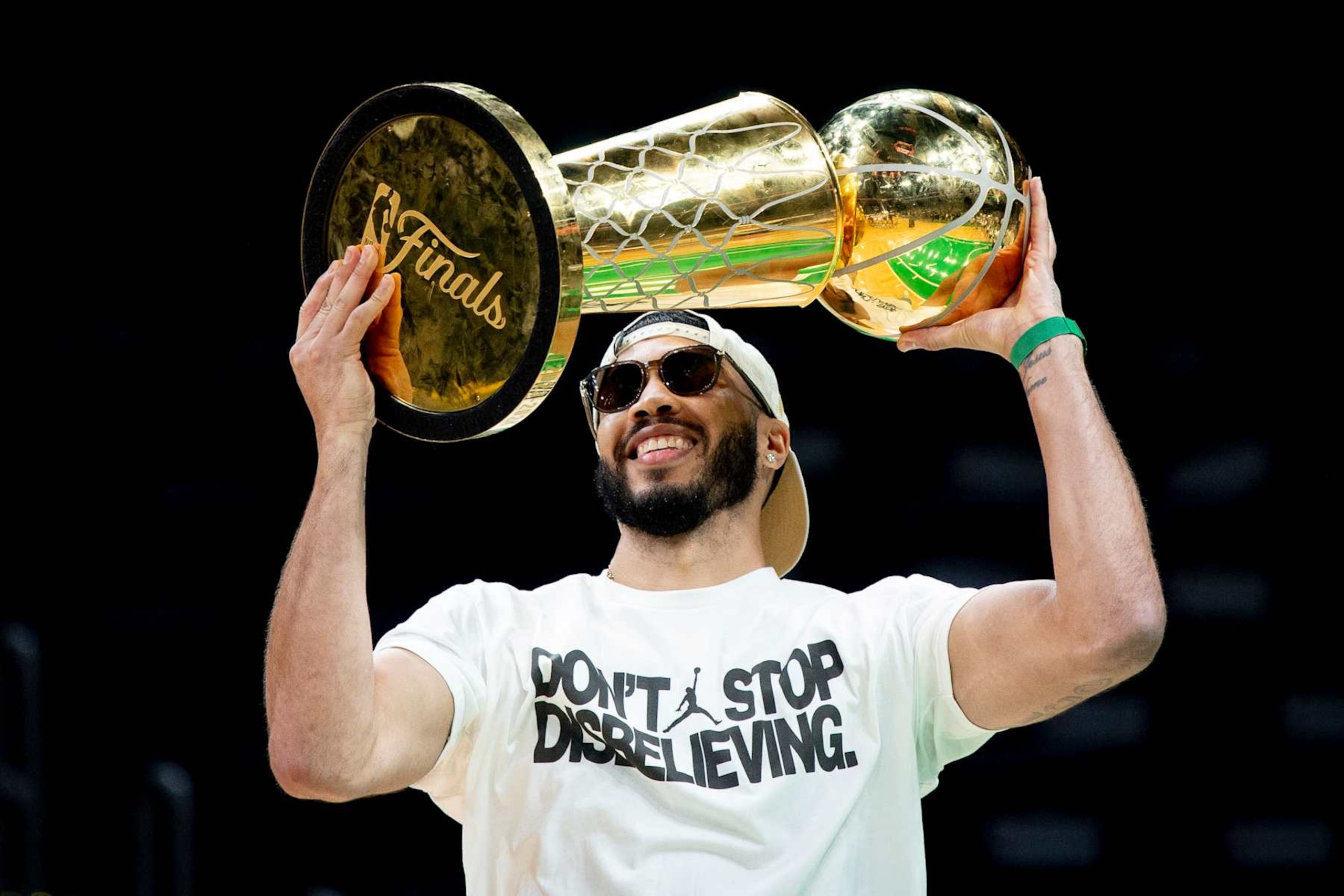 BOSTON, MASSACHUSETTS - JUNE 21: Jayson Tatum #0 of the Boston Celtics hoists the Larry O'Brien trophy as he is introduced during the Boston Celtics Victory Event following their 2024 NBA Finals win at TD Garden on June 21, 2024 in Boston, Massachusetts. (Photo by Maddie Malhotra/Getty Images)