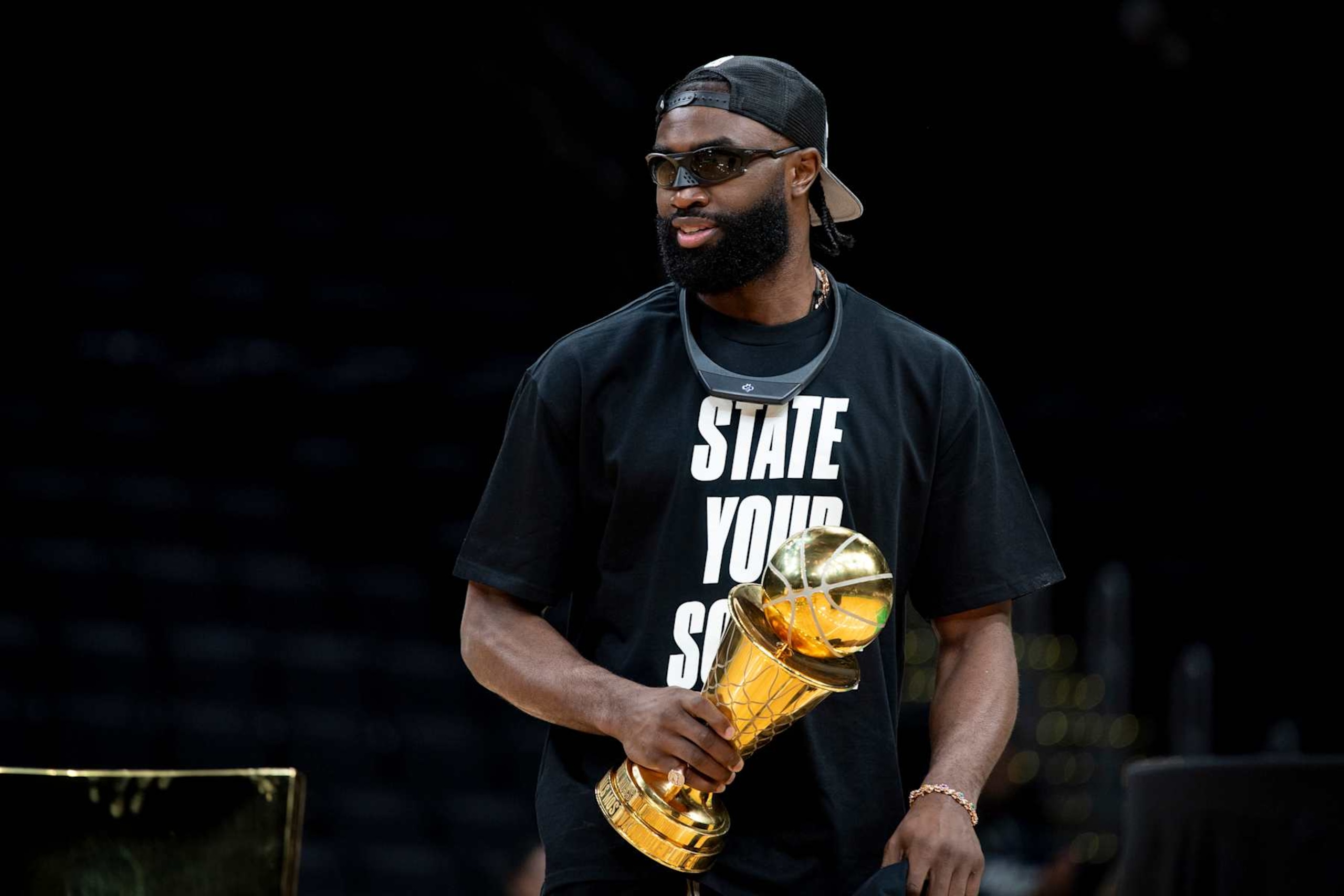 BOSTON, MASSACHUSETTS - JUNE 21: Jaylen Brown #7 of the Boston Celtics is introduced holding the MVP trophy during the Boston Celtics Victory Event following their 2024 NBA Finals win at TD Garden on June 21, 2024 in Boston, Massachusetts. (Photo by Maddie Malhotra/Getty Images)