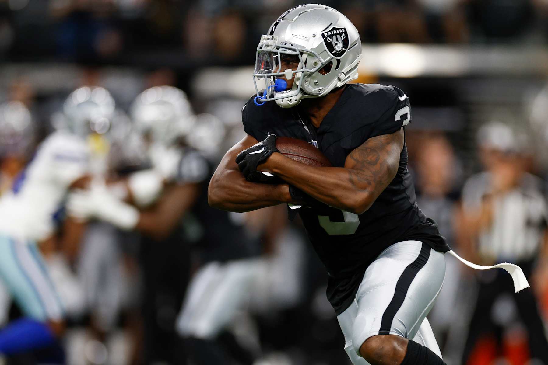 LAS VEGAS, NEVADA - AUGUST 17: Zamir White #3 of the Las Vegas Raiders carries the ball on a running play against the Dallas Cowboys during the first half of a preseason game at Allegiant Stadium on August 17, 2024 in Las Vegas, Nevada. (Photo by Brandon Sloter/Getty Images)