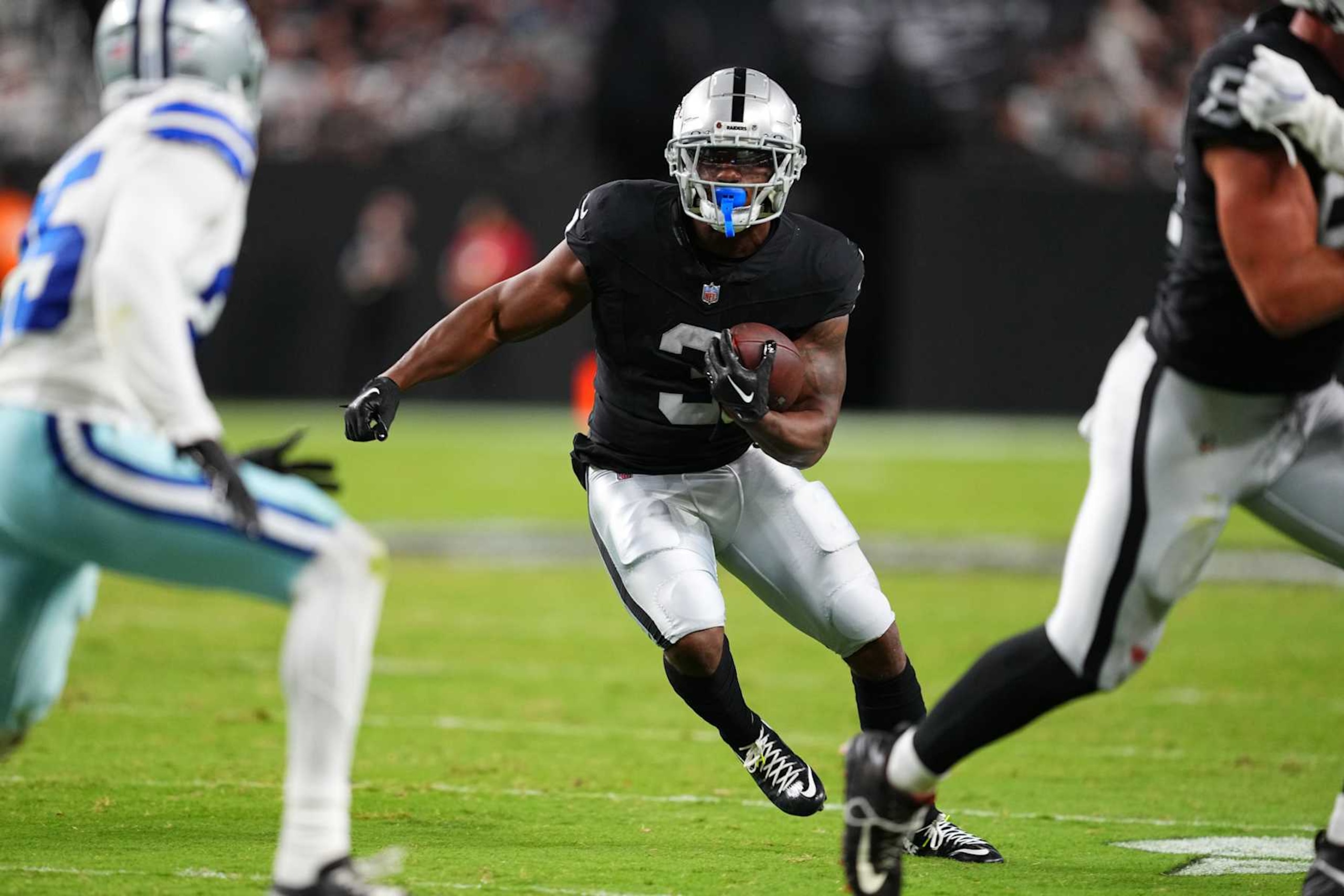 LAS VEGAS, NEVADA - AUGUST 17:  Running back Zamir White #3 of the Las Vegas Raiders runs against the Dallas Cowboys during the first half of a game at Allegiant Stadium on August 17, 2024 in Las Vegas, Nevada.  (Photo by Chris Unger/Getty Images)