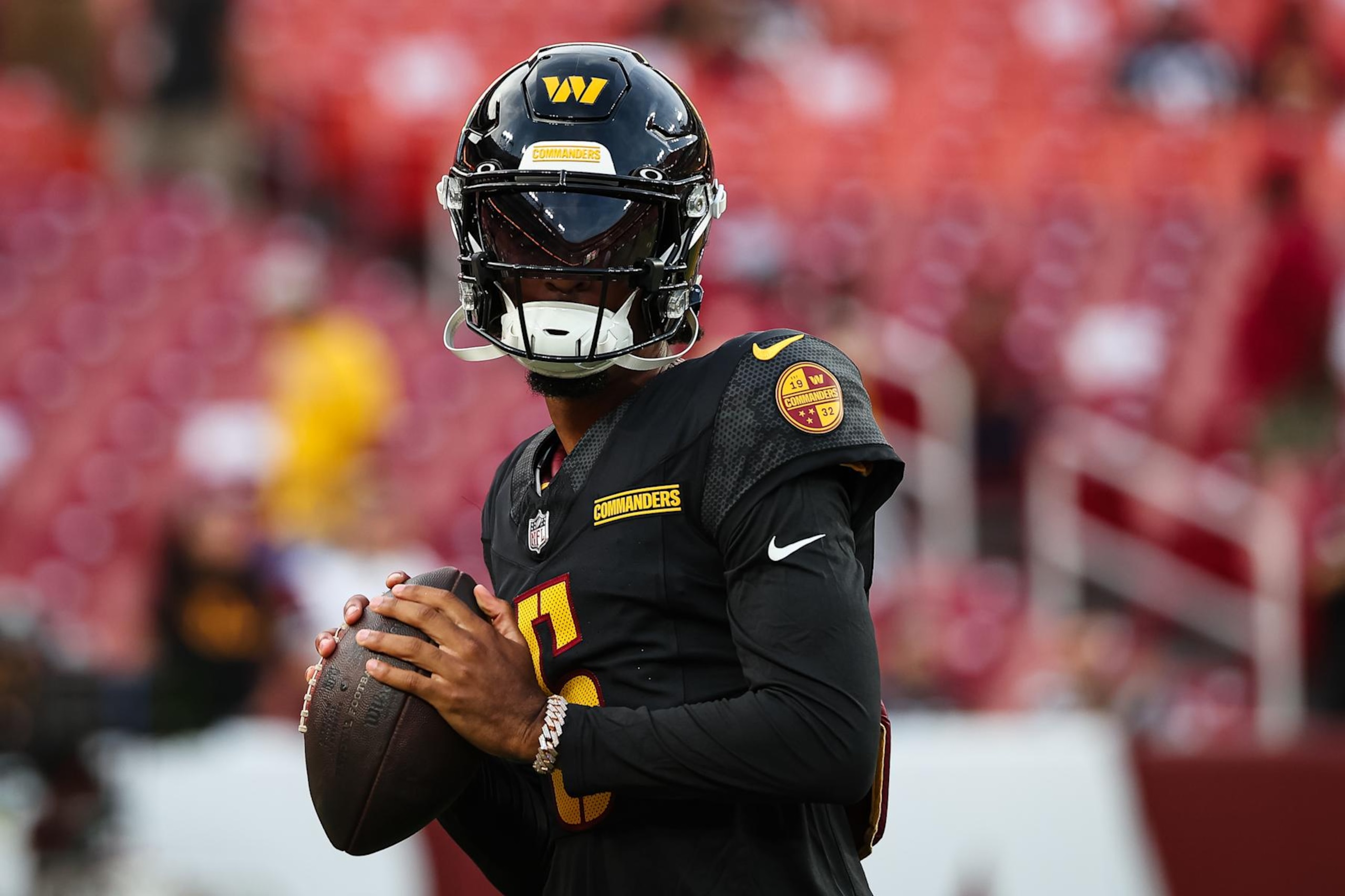 LANDOVER, MD - AUGUST 25: Jayden Daniels #5 of the Washington Commanders warms up before a preseason game against the New England Patriots at Commanders Field on August 25, 2024 in Landover, Maryland. (Photo by Scott Taetsch/Getty Images)