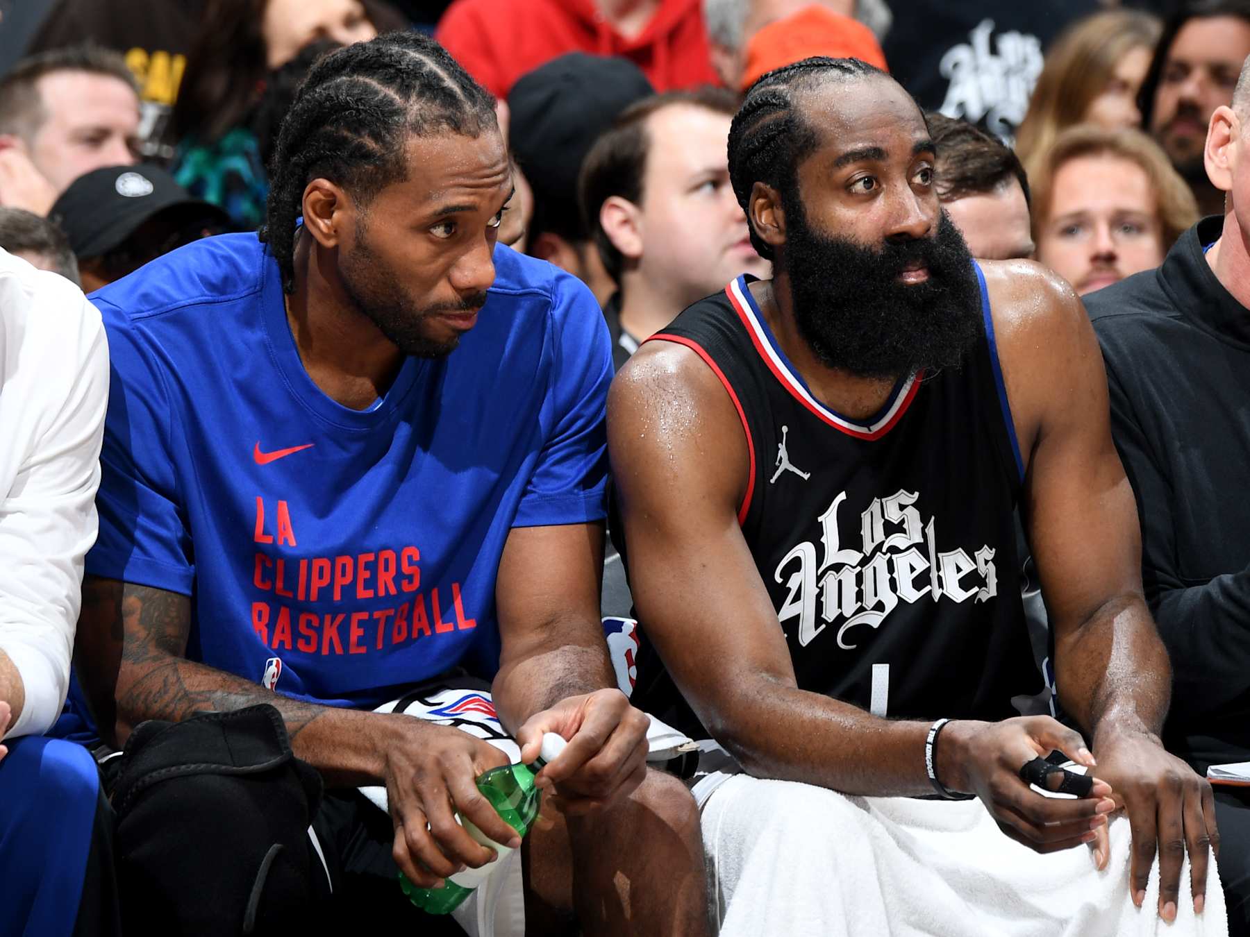 LOS ANGELES, CA - APRIL 23: James Harden #1 and Kawhi Leonard #2 of the LA Clippers look on during the game against the Dallas Mavericks during Round 1 Game 2 of the 2024 NBA Playoffs on April 23, 2024 at Crypto.Com Arena in Los Angeles, California. NOTE TO USER: User expressly acknowledges and agrees that, by downloading and/or using this Photograph, user is consenting to the terms and conditions of the Getty Images License Agreement. Mandatory Copyright Notice: Copyright 2024 NBAE (Photo by Andrew D. Bernstein/NBAE via Getty Images)