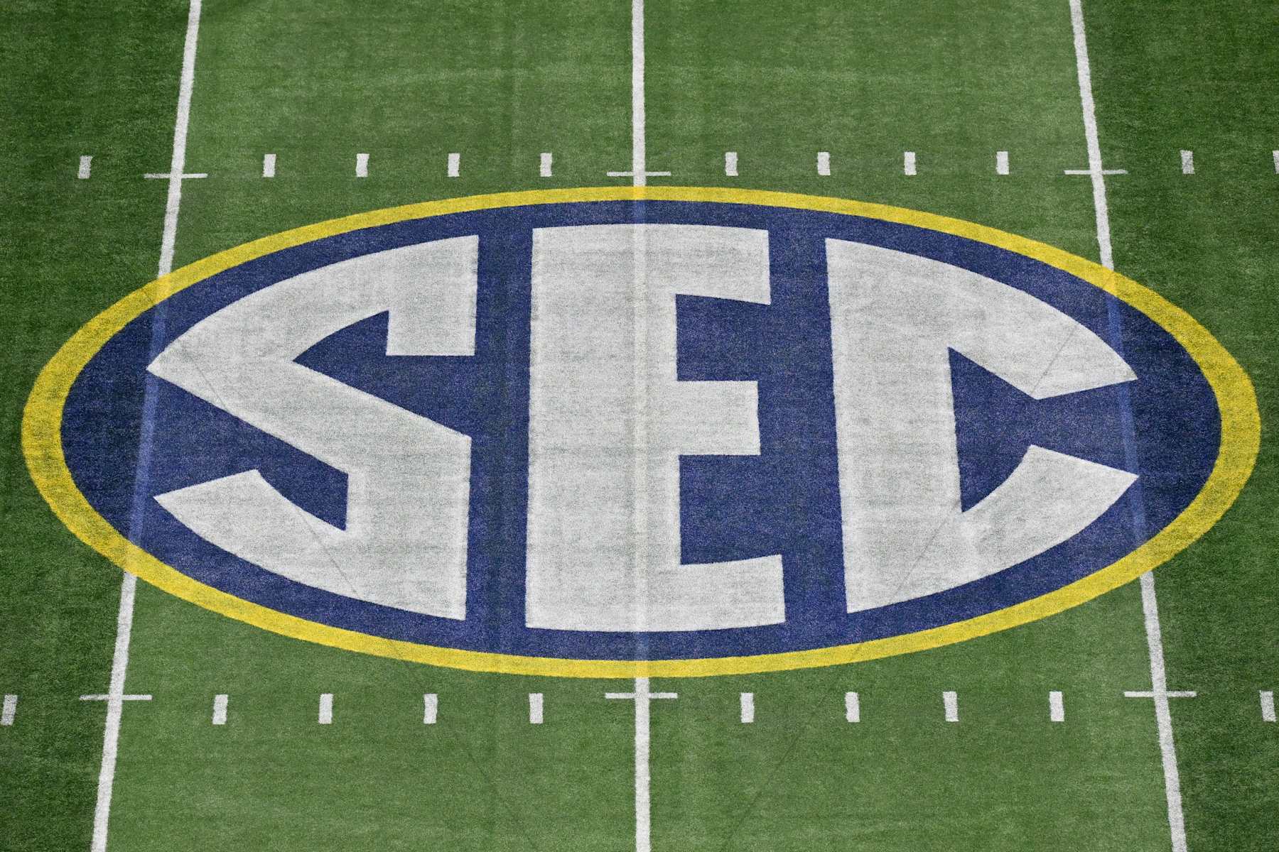 ATLANTA, GEORGIA - DECEMBER 02: A view of the SEC logo at midfield before the SEC Championship football game between the Georgia Bulldogs and the Alabama Crimson Tide at Mercedes-Benz Stadium on December 02, 2023 in Atlanta, Georgia. (Photo by Alika Jenner/Getty Images) ATLANTA, GEORGIA - DECEMBER 02: A view of the SEC logo at midfield before the SEC Championship football game between the Georgia Bulldogs and the Alabama Crimson Tide at Mercedes-Benz Stadium on December 02, 2023 in Atlanta, Georgia. (Photo by Alika Jenner/Getty Images)