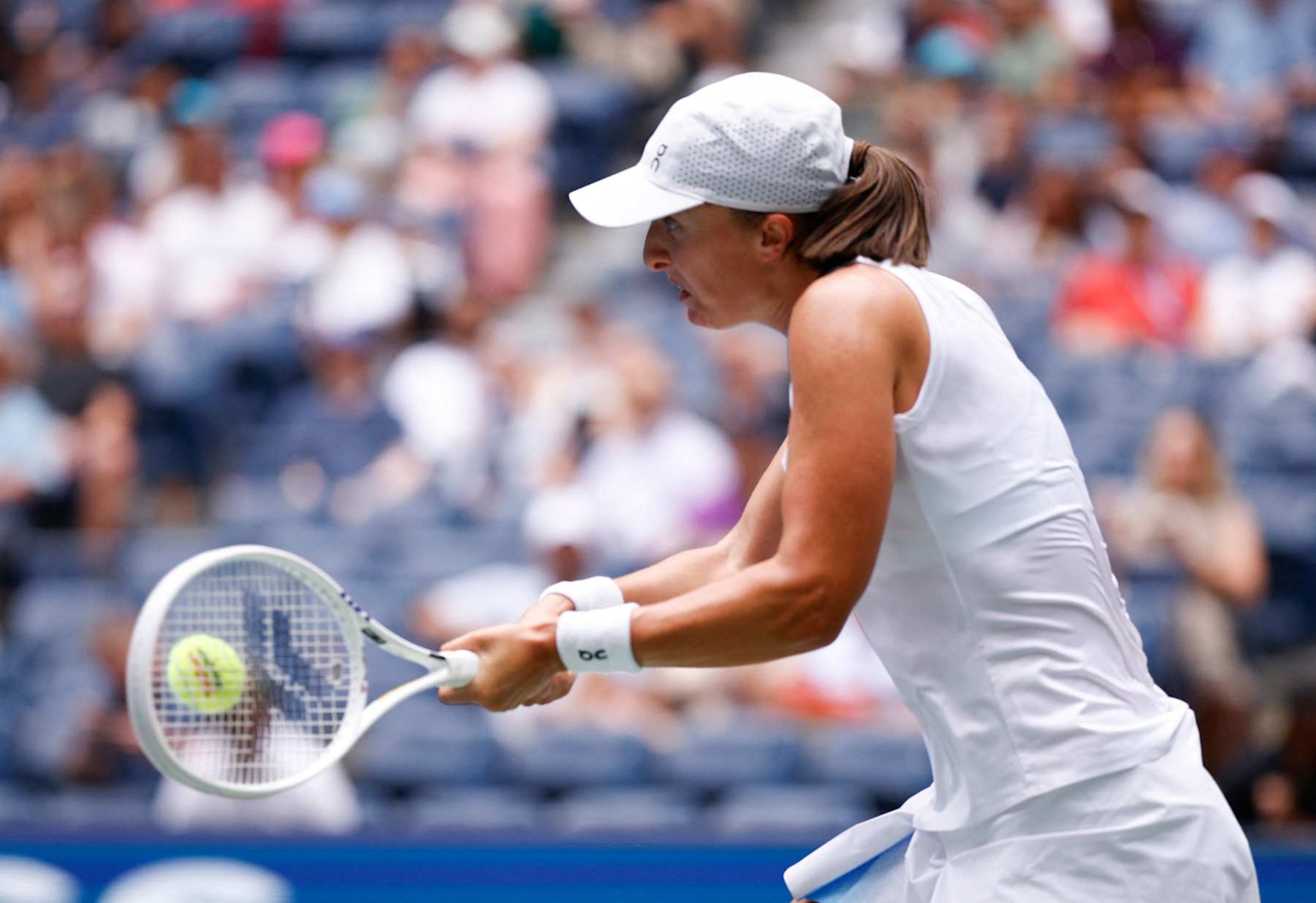Poland's Iga Swiatek hits a return to Ena Shibahara of Japan during their women's singles second round tennis match on day four of the US Open tennis tournament at the USTA Billie Jean King National Tennis Center in New York City, on August 29, 2024. (Photo by KENA BETANCUR / AFP) (Photo by KENA BETANCUR/AFP via Getty Images)