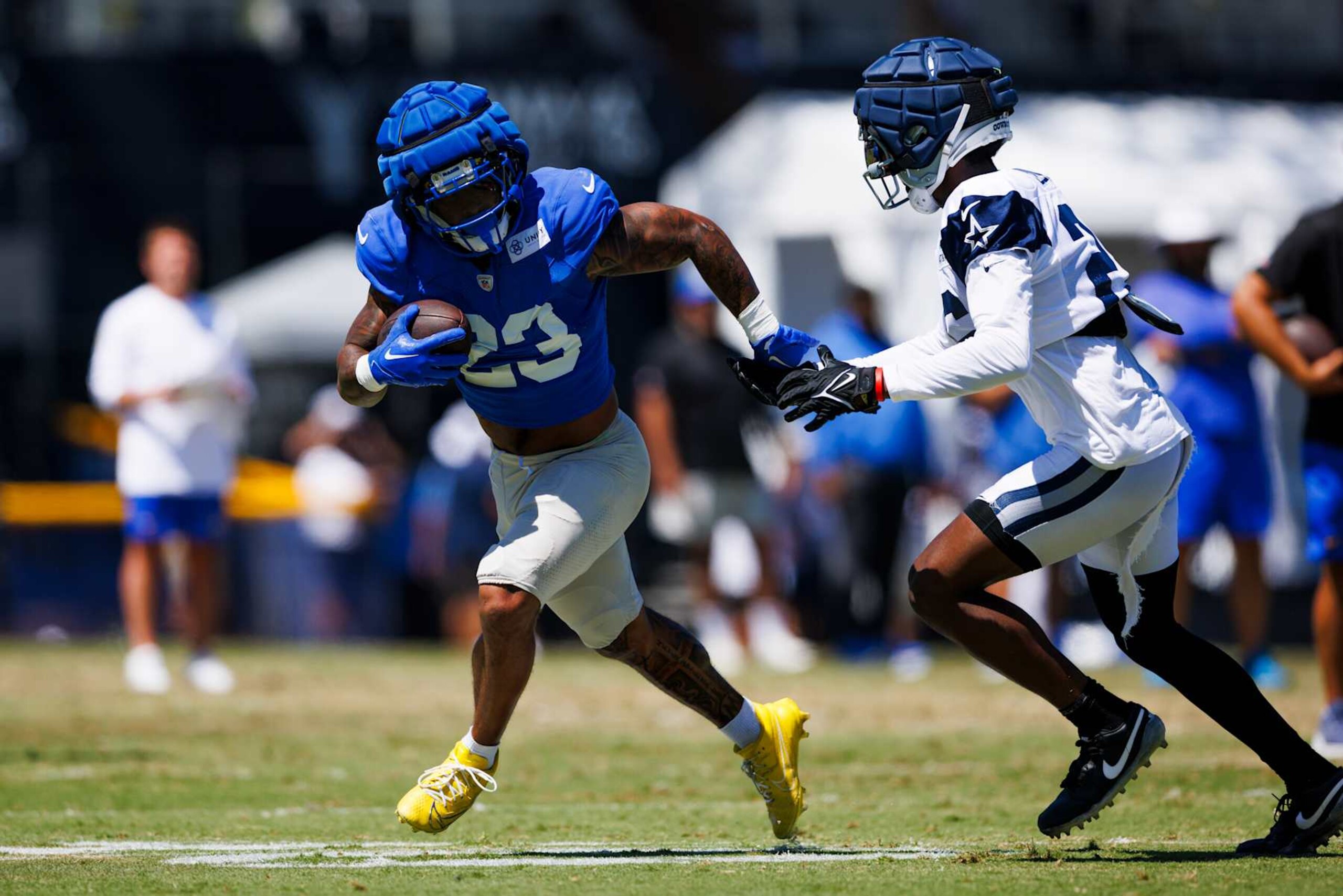 OXNARD, CALIFORNIA - AUGUST 14: Kyren Williams #23 of the Los Angeles Rams runs with the ball during a joint practice against the Dallas Cowboys at River Ridge Playing Fields on August 14, 2024 in Oxnard, California. (Photo by Ric Tapia/Getty Images) OXNARD, CALIFORNIA - AUGUST 14: Kyren Williams #23 of the Los Angeles Rams runs with the ball during a joint practice against the Dallas Cowboys at River Ridge Playing Fields on August 14, 2024 in Oxnard, California. (Photo by Ric Tapia/Getty Images)