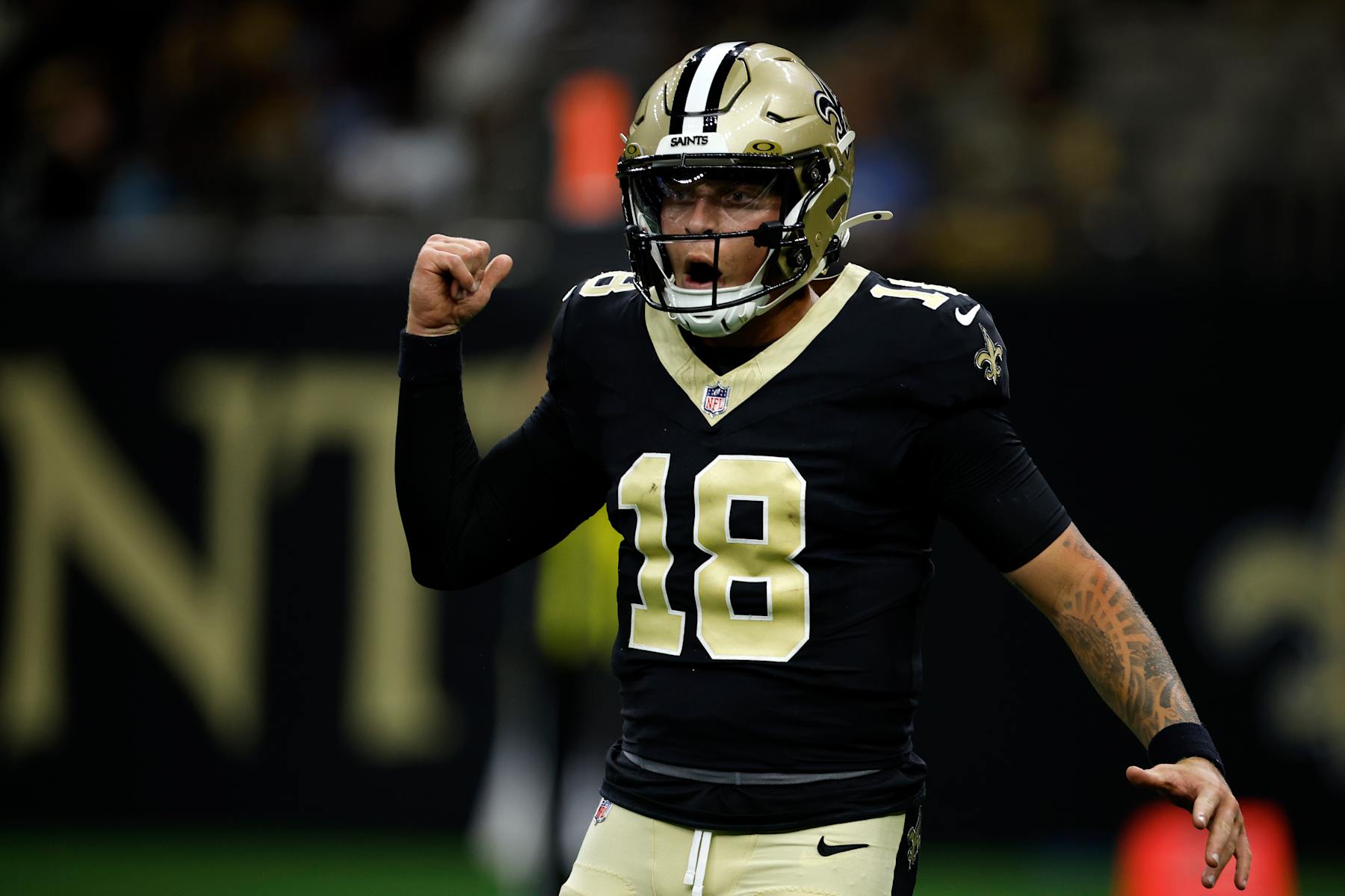 NEW ORLEANS, LOUISIANA - AUGUST 25: Spencer Rattler #18 of the New Orleans Saints reacts after throwing a touchdown against the Tennessee Titans at Mercedes Benz Superdome on August 25, 2024 in New Orleans, Louisiana. (Photo by Chris Graythen/Getty Images)