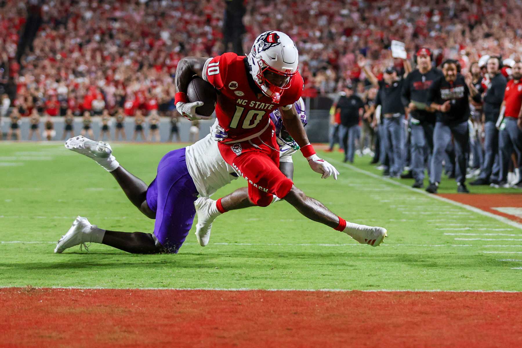 RALEIGH, NC - AUGUST 29: NC State Wolfpack wide receiver Kevin "Kc" Concepcion (10) runs to the end zone for a touchdown during the college football game between the NC State Wolfpack and the Western Carolina Catamounts on August 29, 2024 at Carter-Finley Stadium in Raleigh, NC. (Photo by Nicholas Faulkner/Icon Sportswire via Getty Images)