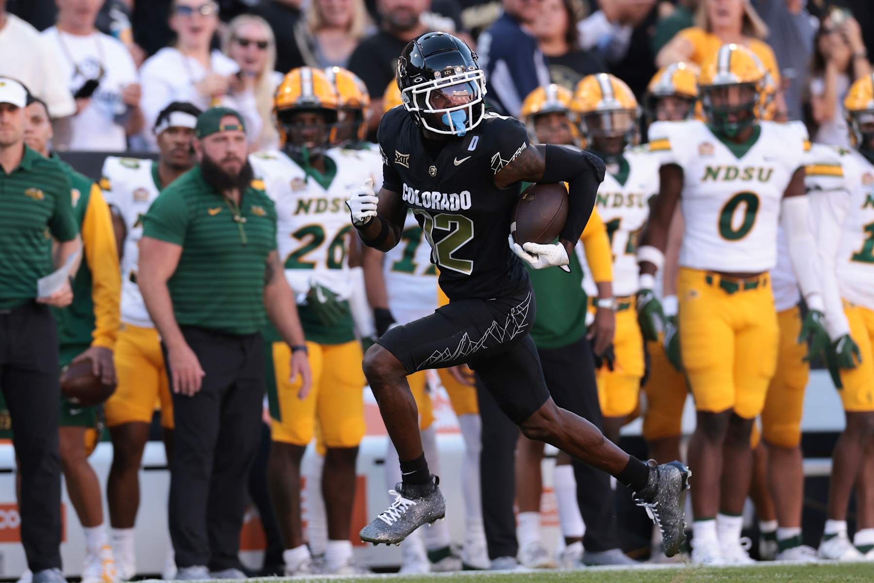 BOULDER, COLORADO - AUGUST 29: Travis Hunter #12 of the Colorado Buffaloes runs with the ball for a touchdown during the first quarter against the North Dakota State Bison at Folsom Field on August 29, 2024 in Boulder, Colorado. (Photo by Andrew Wevers/Getty Images)
