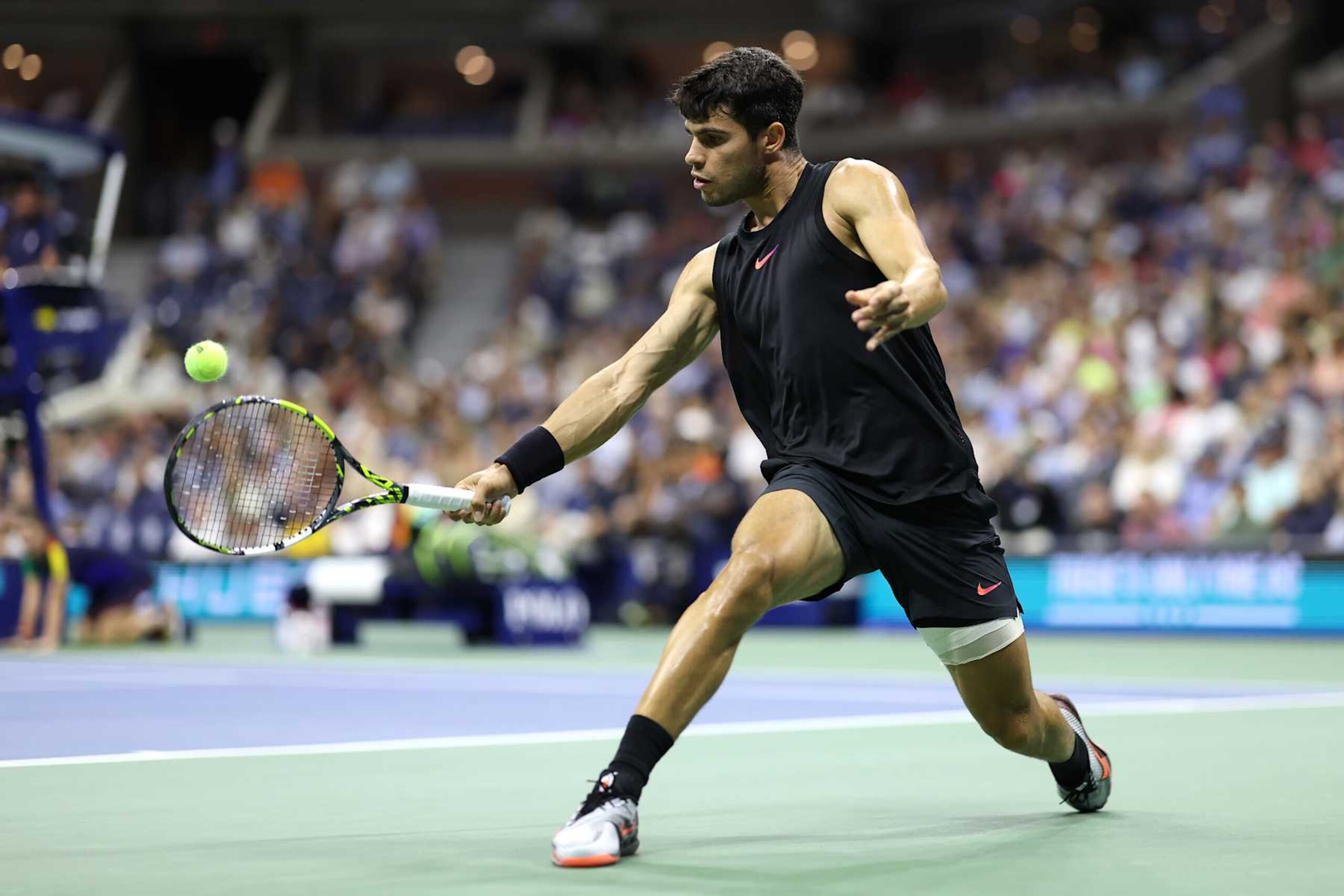 NEW YORK, NEW YORK - AUGUST 29: Carlos Alcaraz of Spain returns against Botic van De Zandschulp of the Netherlands during their Men's Singles Second Round match on Day Four of the 2024 US Open at USTA Billie Jean King National Tennis Center on August 29, 2024 in the Flushing neighborhood of the Queens borough of New York City. (Photo by Luke Hales/Getty Images)