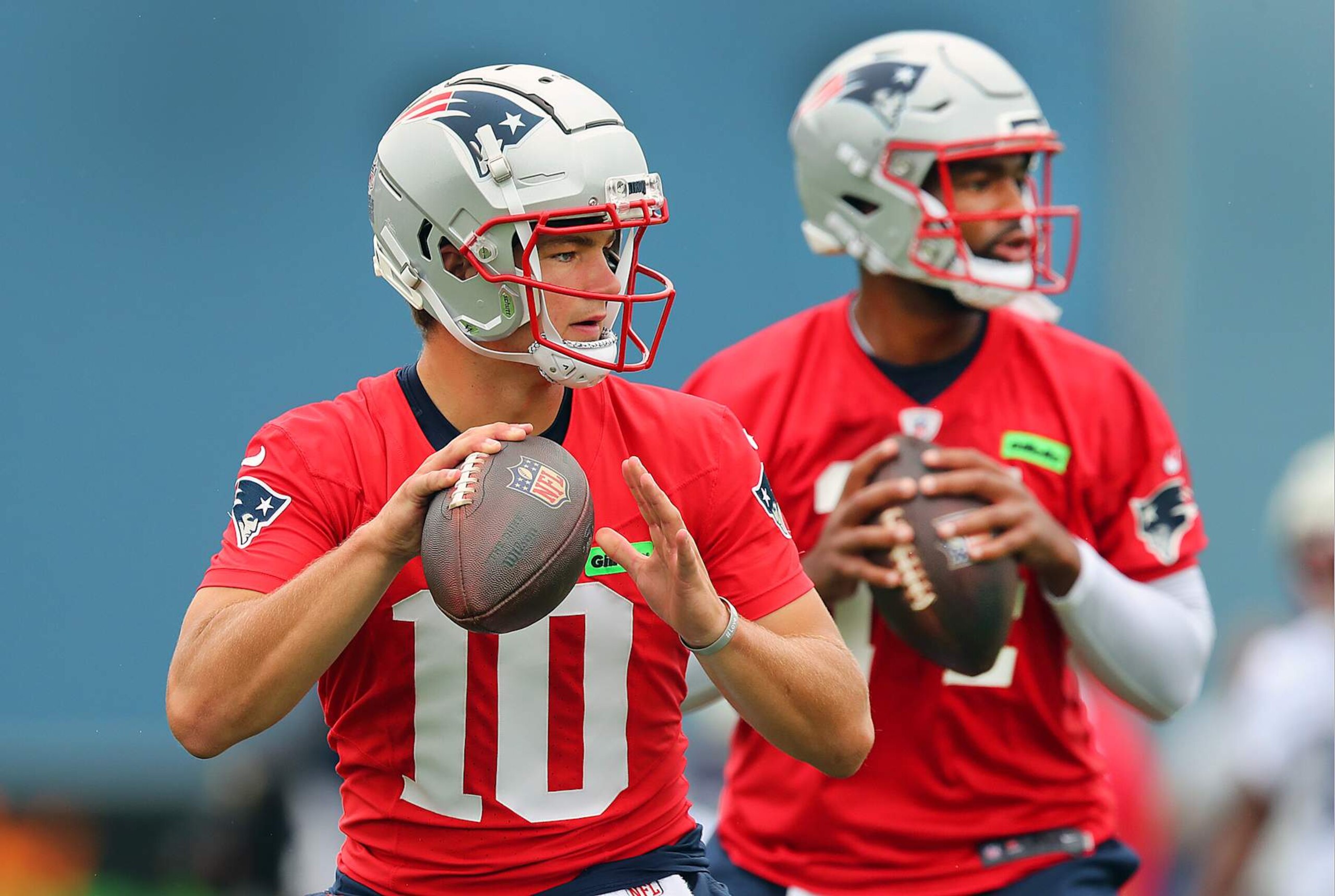 Foxborough, MA - July 24: New England Patriots QBs Drake Maye and Jacoby Brissett take part in a passing drill. (Photo by John Tlumacki/The Boston Globe via Getty Images)