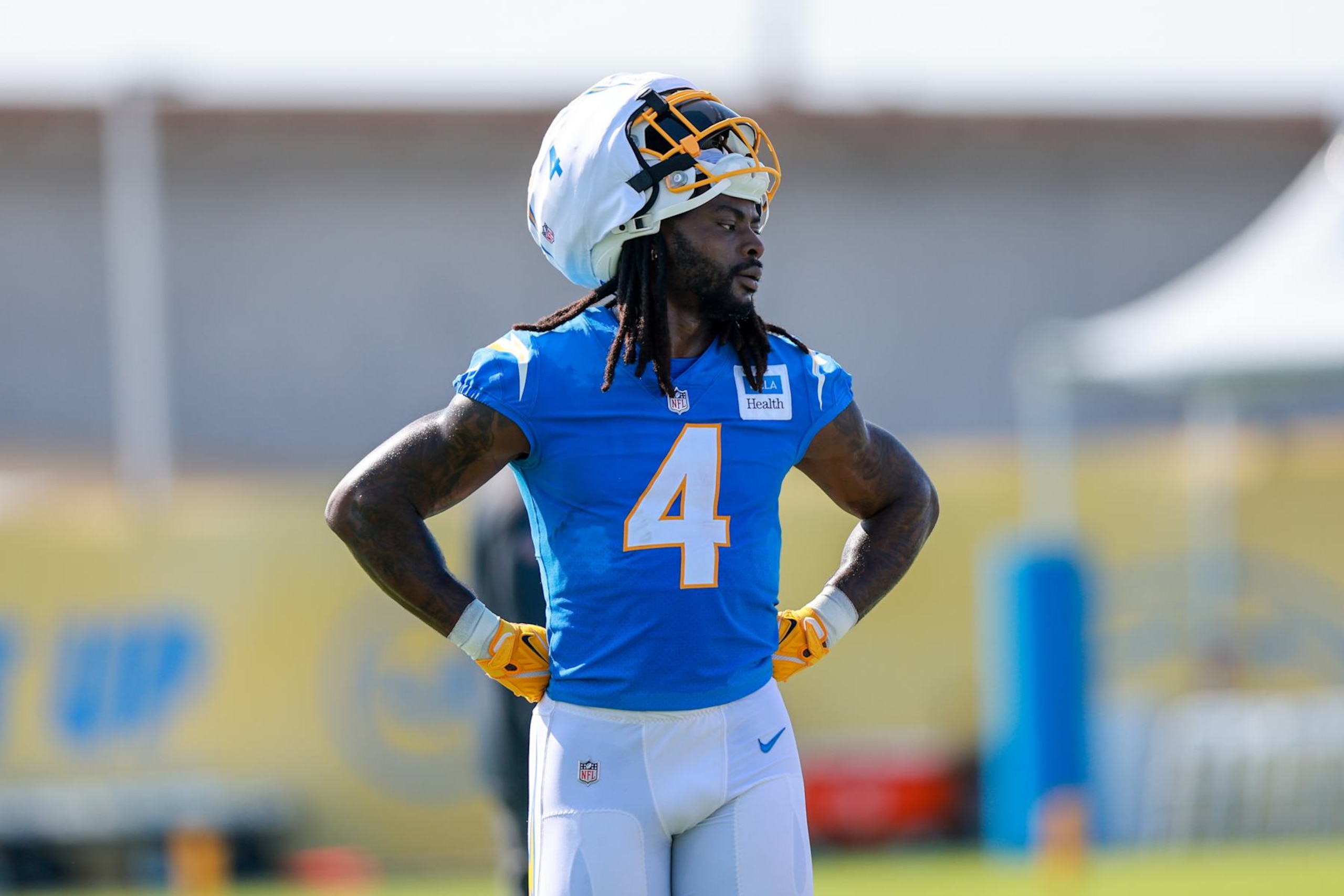 EL SEGUNDO, CA - JULY 24: Los Angeles Chargers running back Gus Edwards (4) takes a quick break during the Los Angeles Chargers Training Camp on July 24, 2024, at The Bolt in El Segundo, CA. (Photo by Jordon Kelly/Icon Sportswire via Getty Images)