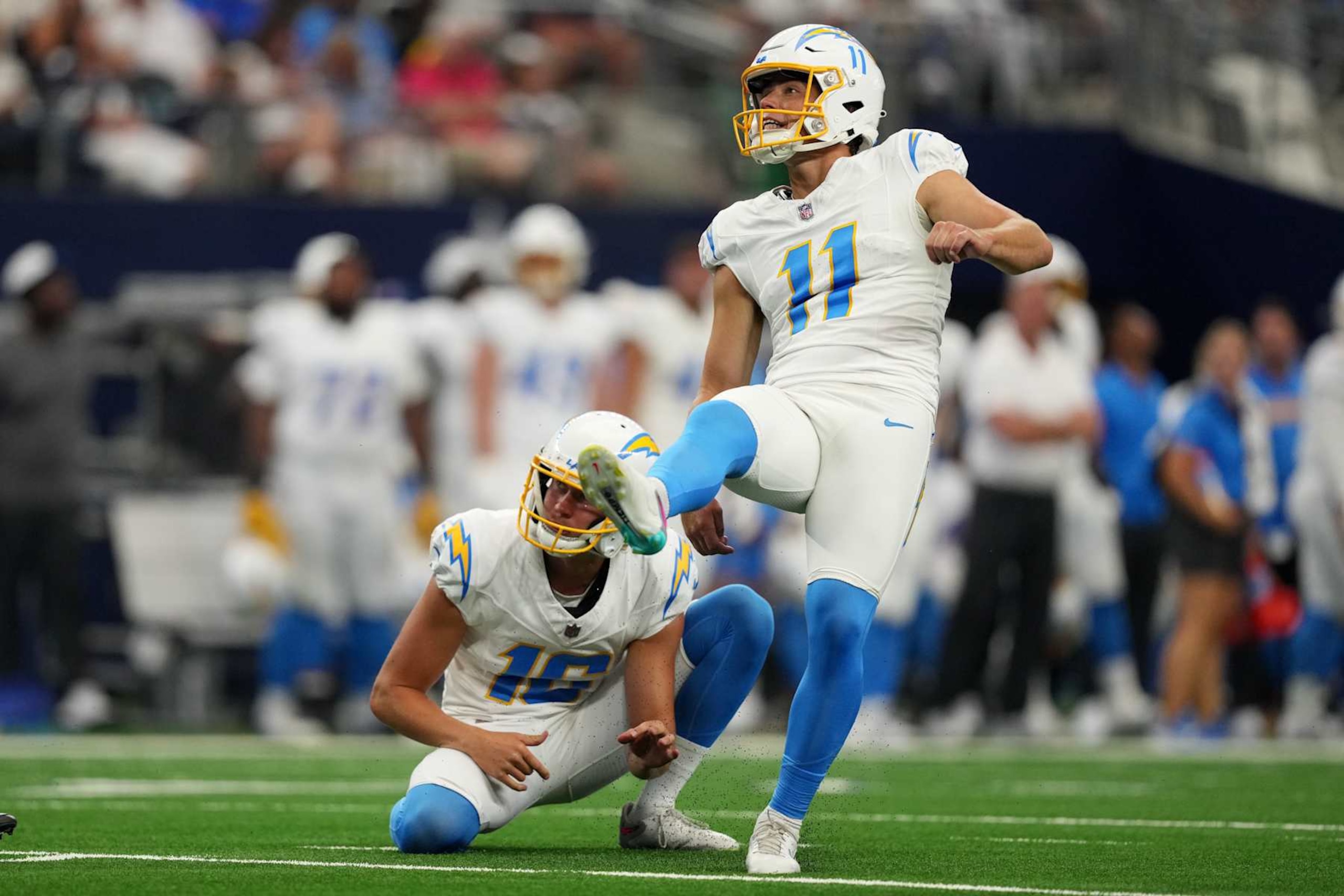 ARLINGTON, TEXAS - AUGUST 24: Cameron Dicker #11 of the Los Angeles Chargers watches the flight of his field goal attempt during the first half of a preseason game \D at AT&T Stadium on August 24, 2024 in Arlington, Texas. (Photo by Sam Hodde/Getty Images)
