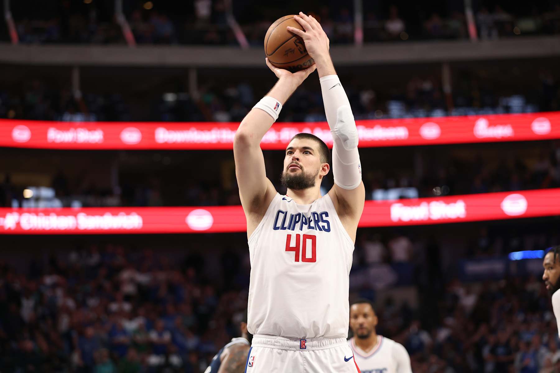 DALLAS, TX - APRIL 28: Ivica Zubac #40 of the LA Clippers shoots a free throw during the game against the Dallas Mavericks during Round 1 Game 4 of the 2024 NBA Playoffs on April 28, 2024 at the American Airlines Center in Dallas, Texas. NOTE TO USER: User expressly acknowledges and agrees that, by downloading and or using this photograph, User is consenting to the terms and conditions of the Getty Images License Agreement. Mandatory Copyright Notice: Copyright 2024 NBAE (Photo by Tim Heitman/NBAE via Getty Images)