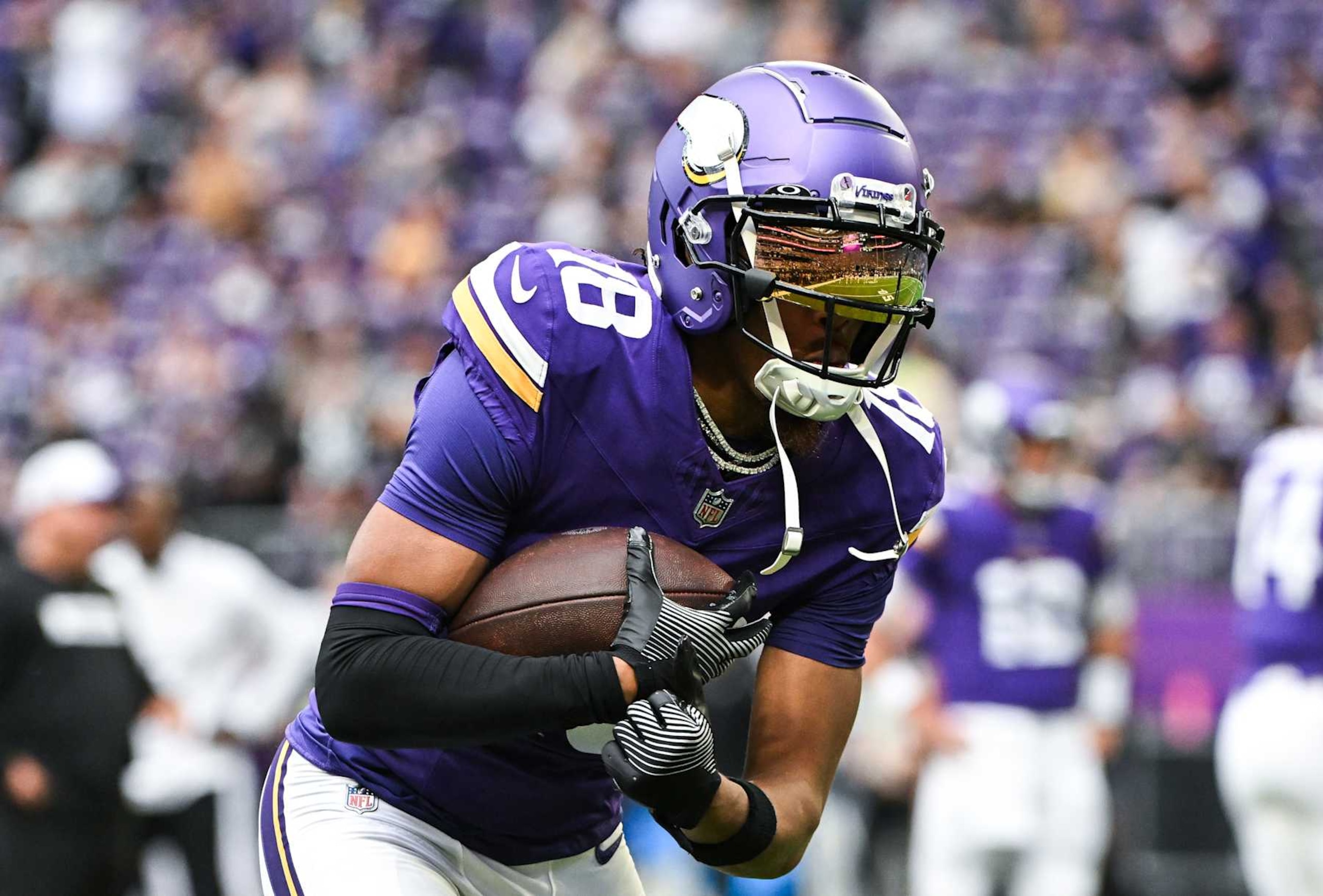 MINNEAPOLIS, MINNESOTA - AUGUST 10: Justin Jefferson #18 of the Minnesota Vikings warms up before the preseason game against the Las Vegas Raiders at U.S. Bank Stadium on August 10, 2024 in Minneapolis, Minnesota. (Photo by Stephen Maturen/Getty Images)