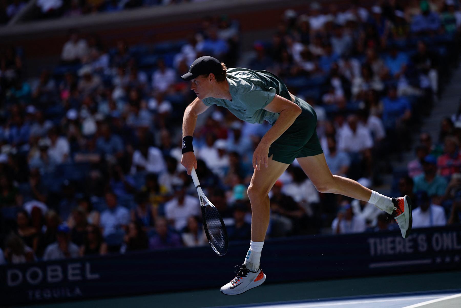 Italy's Jannik Sinner plays a return to Australia's Christopher O'Connell during their men's singles third round match on day six of the US Open tennis tournament at the USTA Billie Jean King National Tennis Center in New York City, on August 31, 2024. (Photo by KENA BETANCUR / AFP) (Photo by KENA BETANCUR/AFP via Getty Images)