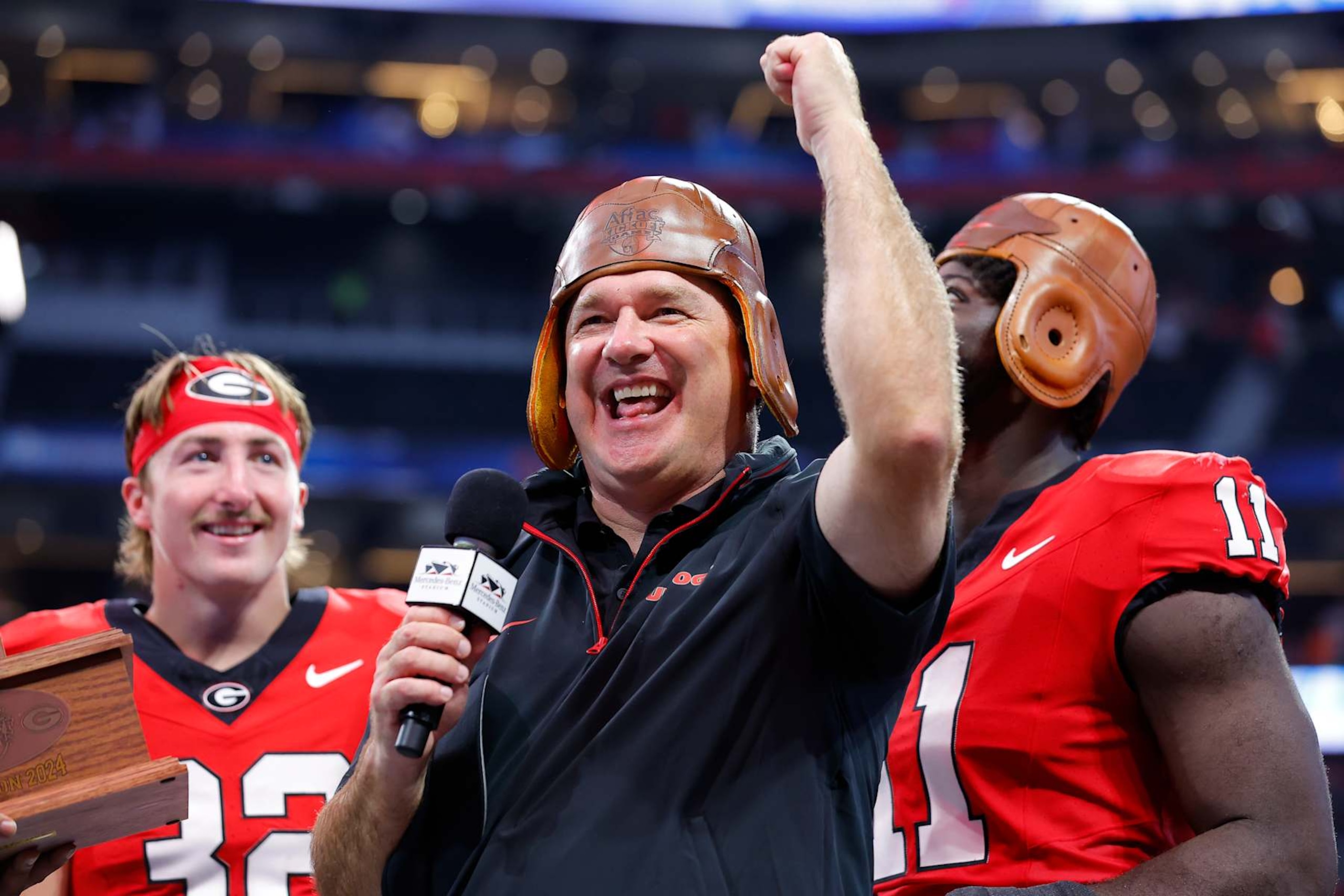 ATHENS, GEORGIA - AUGUST 31: Head coach Kirby Smart of the Georgia Bulldogs speaks to the fans following the 34-3 victory over the Clemson Tigers in the Aflac Kickoff Game at Mercedes-Benz Stadium on August 31, 2024 in Atlanta, Georgia.  (Photo by Todd Kirkland/Getty Images)