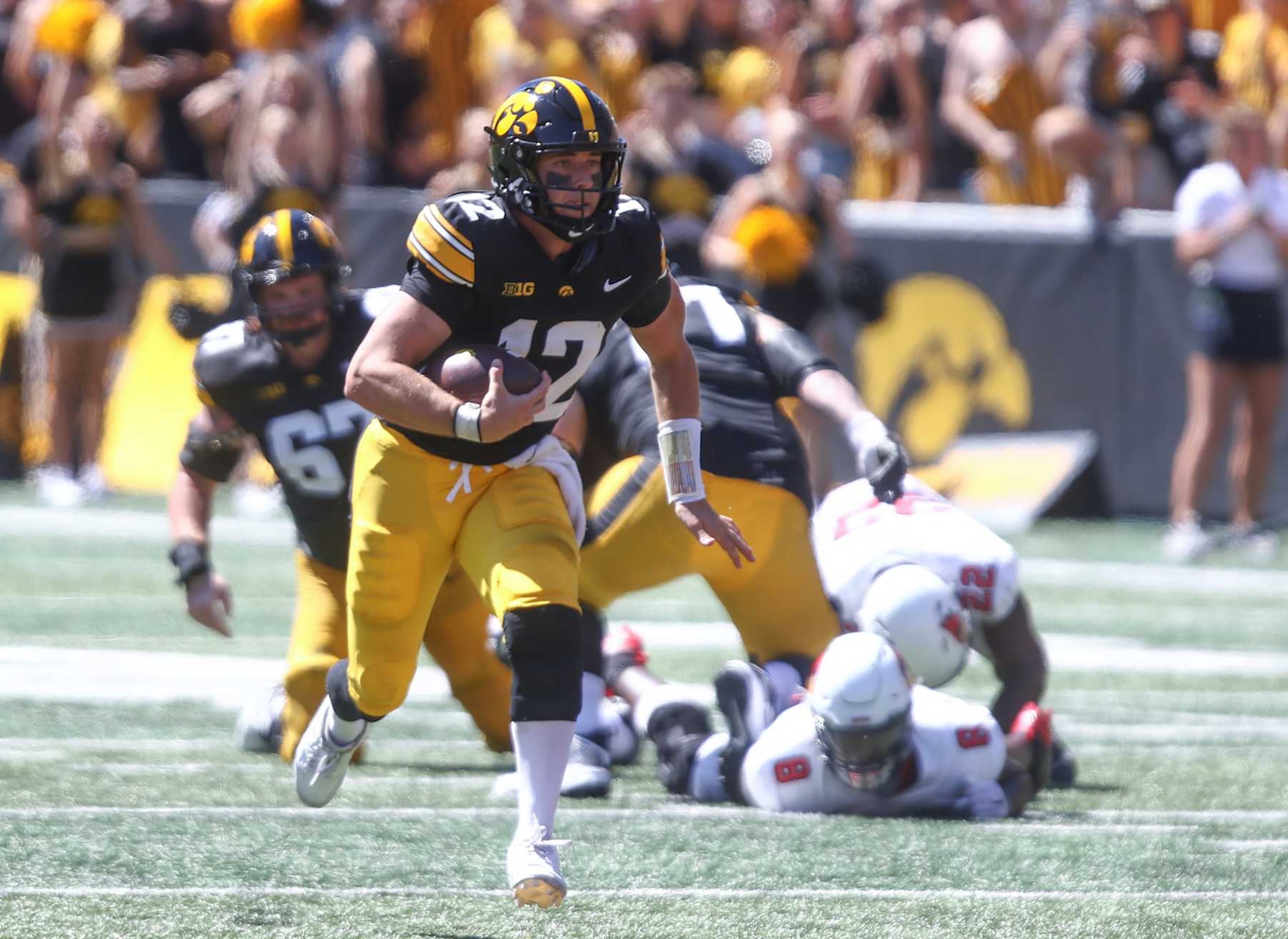 IOWA CITY, IOWA- AUGUST 31: Quarterback Cade McNamara #12 of the Iowa Hawkeyes scrambles on a keeper during the first half against the Illinois State Redbirds at Kinnick Stadium on August 31, 2024 in Iowa City, Iowa. (Photo by Matthew Holst/Getty Images) IOWA CITY, IOWA- AUGUST 31: Quarterback Cade McNamara #12 of the Iowa Hawkeyes scrambles on a keeper during the first half against the Illinois State Redbirds at Kinnick Stadium on August 31, 2024 in Iowa City, Iowa. (Photo by Matthew Holst/Getty Images)