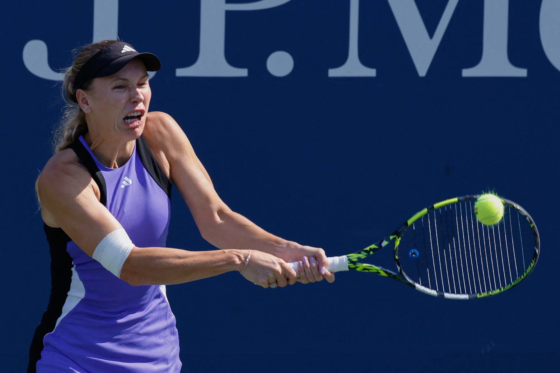 Denmark's Caroline Wozniacki plays a return to France's Jessika Ponchet during their women's singles third round match on day six of the US Open tennis tournament at the USTA Billie Jean King National Tennis Center in New York City, on August 31, 2024. (Photo by KENA BETANCUR / AFP) (Photo by KENA BETANCUR/AFP via Getty Images)