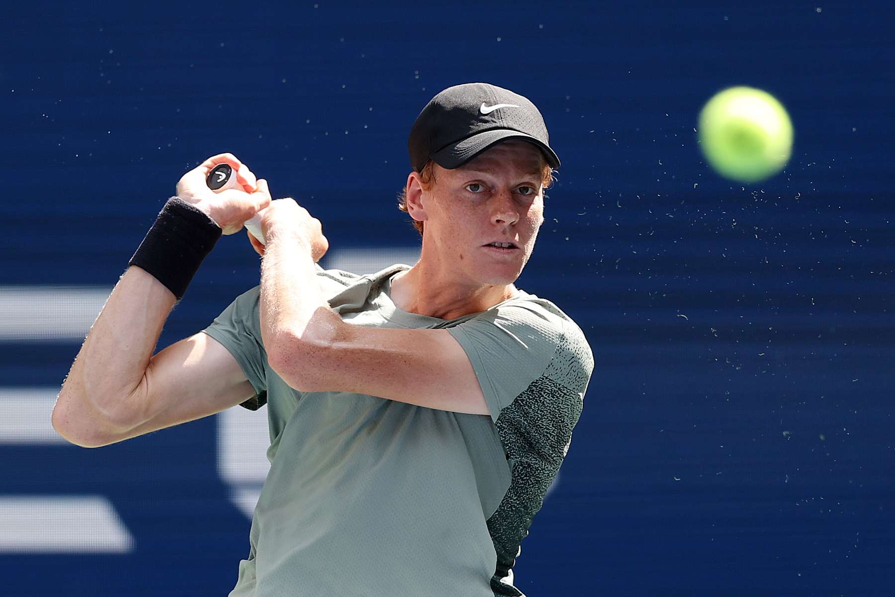 NEW YORK, NEW YORK - AUGUST 31: Jannik Sinner of Italy returns a shot against Christopher O'Connell of Australia during their Men's Singles Third Round match on Day Six of the 2024 US Open at USTA Billie Jean King National Tennis Center on August 31, 2024 in the Flushing neighborhood of the Queens borough of New York City. (Photo by Mike Stobe/Getty Images)