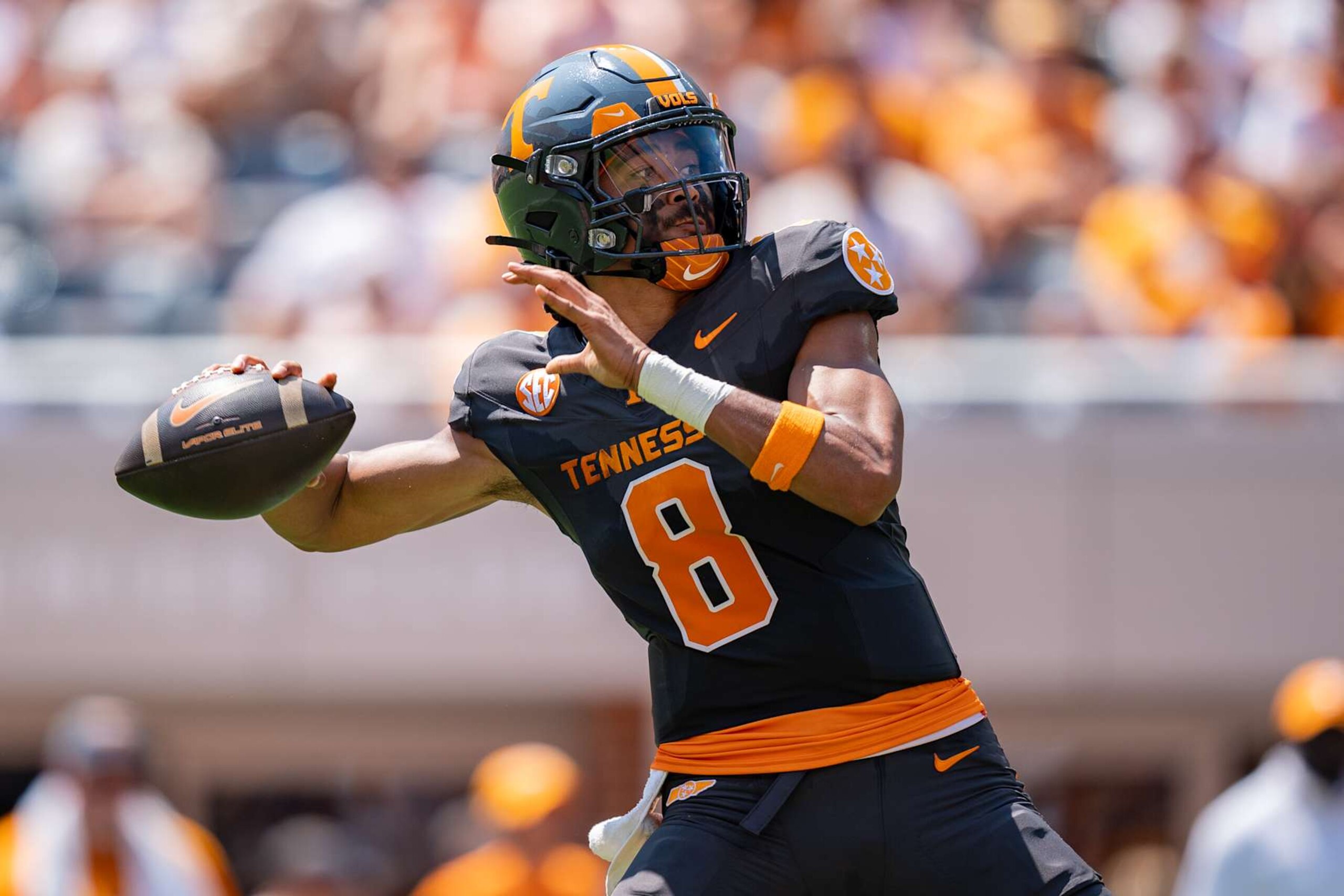 KNOXVILLE, TENNESSEE - AUGUST 31: Nico Iamaleava #8 of the Tennessee Volunteers drops back to pass the ball in the second quarter during their game against the Chattanooga Mocs at Neyland Stadium on August 31, 2024 in Knoxville, Tennessee. (Photo by Jacob Kupferman/Getty Images) KNOXVILLE, TENNESSEE - AUGUST 31: Nico Iamaleava #8 of the Tennessee Volunteers drops back to pass the ball in the second quarter during their game against the Chattanooga Mocs at Neyland Stadium on August 31, 2024 in Knoxville, Tennessee. (Photo by Jacob Kupferman/Getty Images)