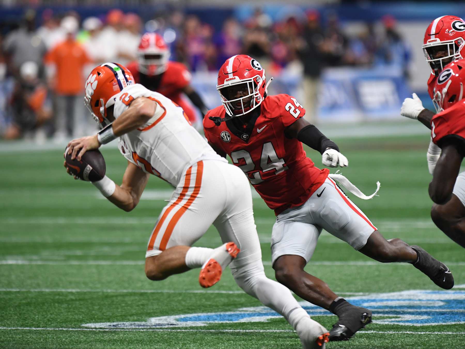 ATLANTA, GA - AUGUST 31: Georgia Bulldogs defensive back Malaki Starks (24) pressures Clemson Tigers quarterback Cade Klubnik (2) during the AFLAC Kickoff Game between the Clemson Tigers and the Georgia Bulldogs on August 31, 2024, at Mercedes-Benz Stadium in Atlanta, Ga. (Photo by Jeffrey Vest/Icon Sportswire via Getty Images)