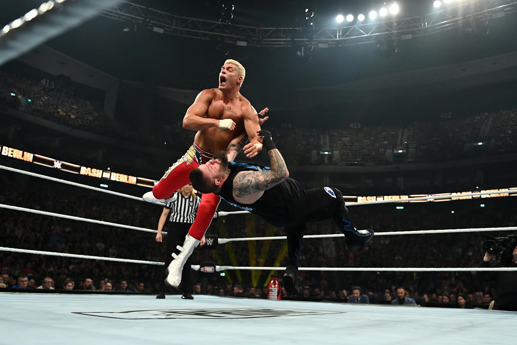 BERLIN, GERMANY - AUGUST 31: WWE Undisputed Universal Champion Cody Rhodes throws a forearm into Kevin Owens during the WWE Bash in Berlin Premium Live Event at Uber Arena on August 31, 2024 in Berlin, Berlin.  (Photo by WWE/Getty Images)